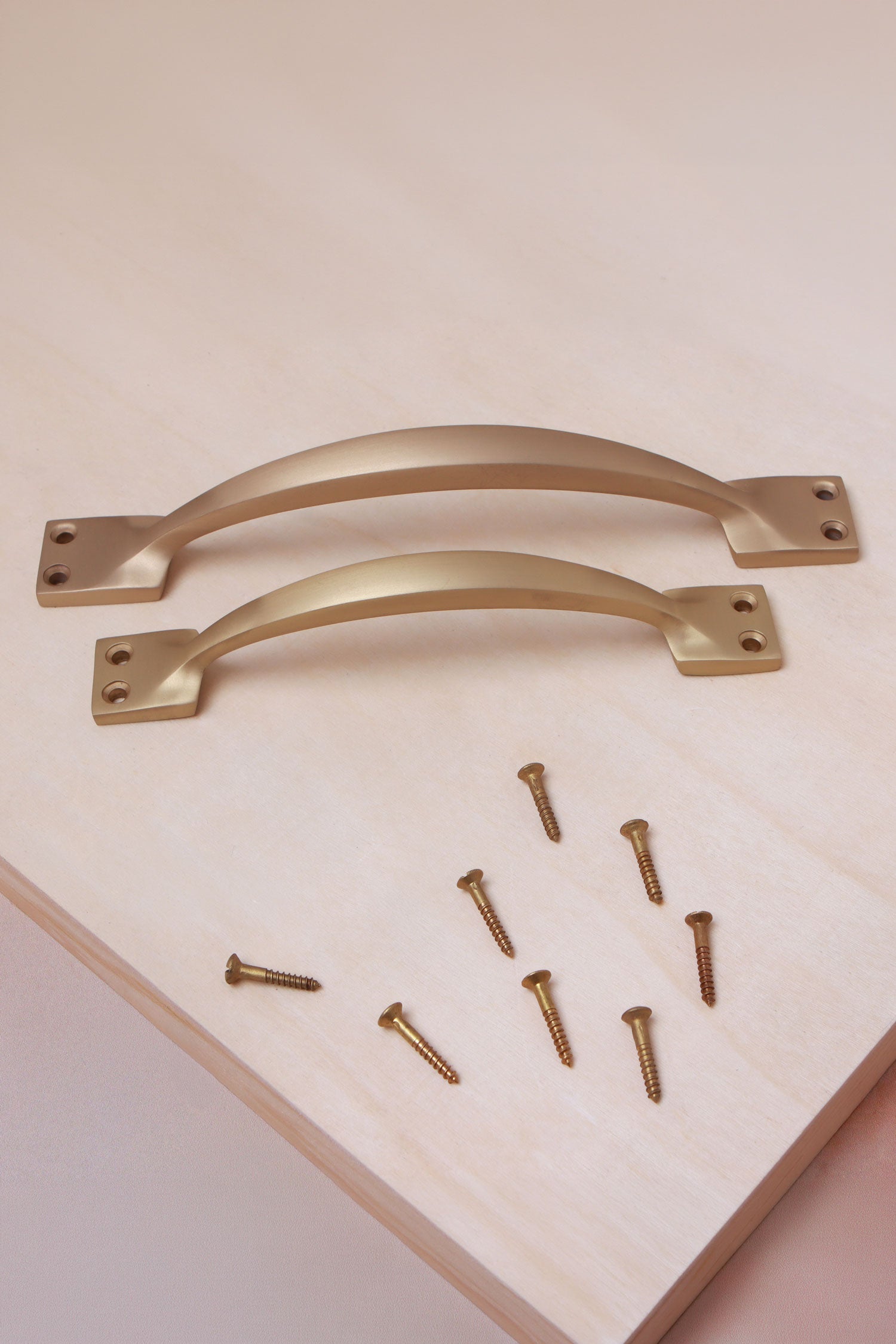Cupboard pull handle in satin brass, both sizes with solid brass screws