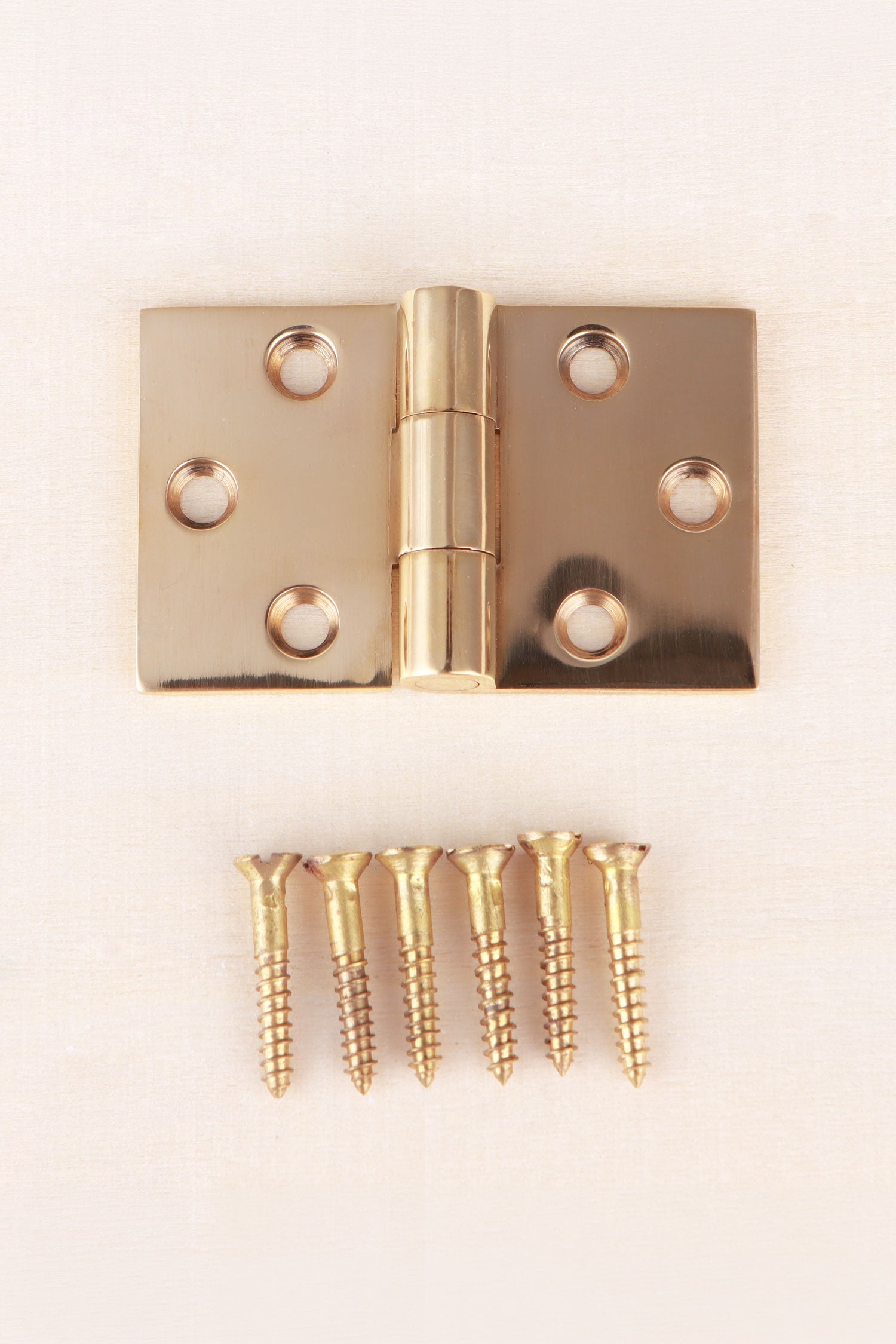Backflap hinge in polished brass, unlacquered living finish