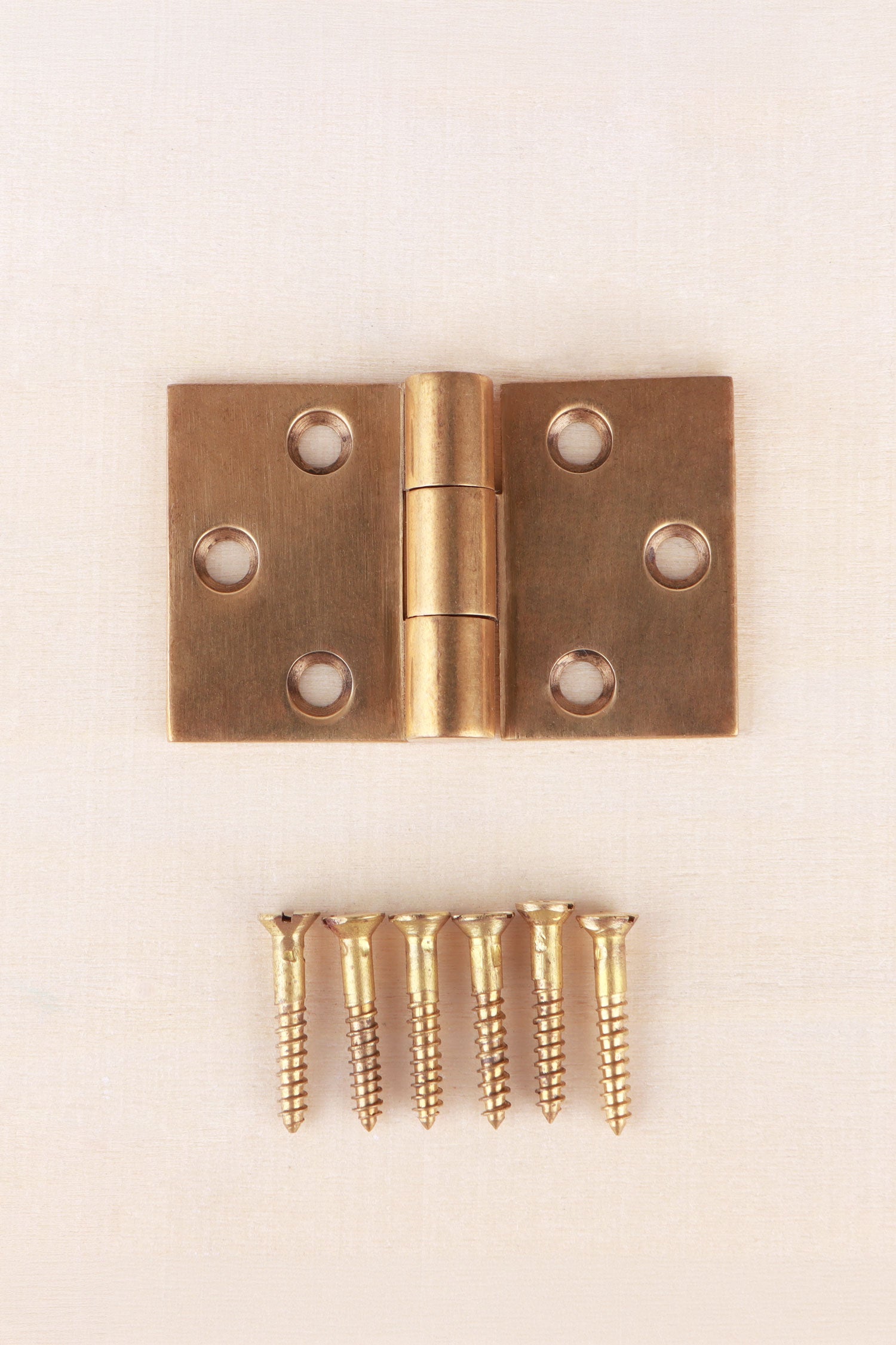 Backflap hinge in aged brass, unlacquered living finish
