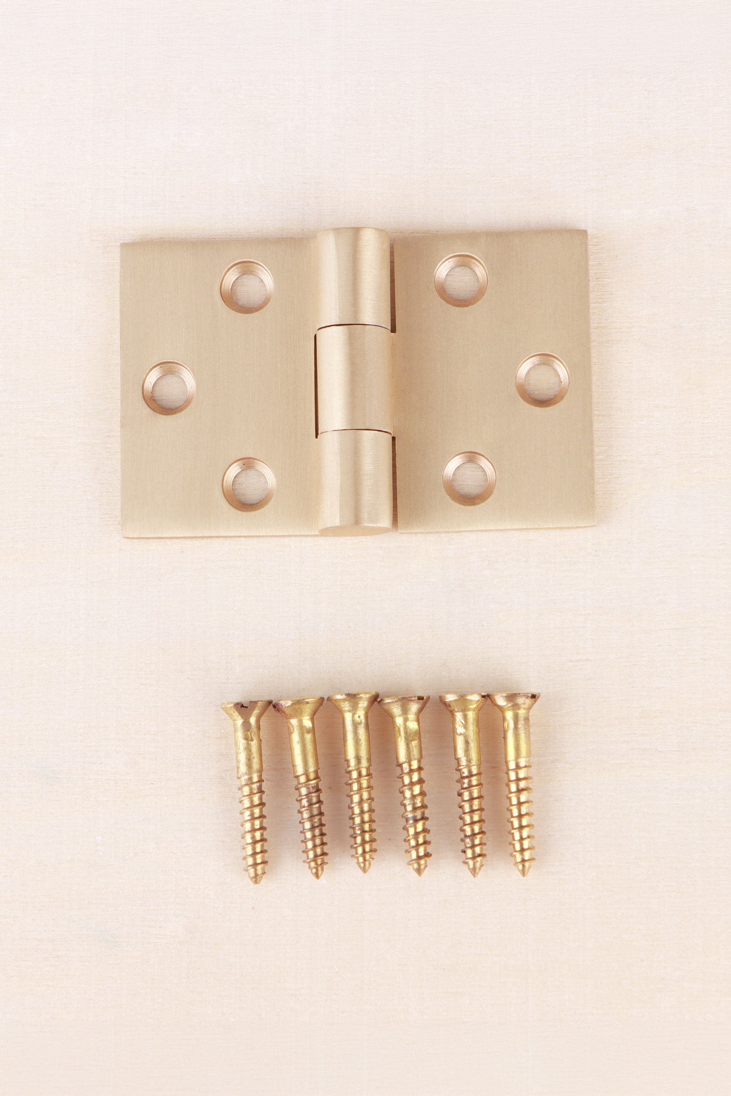 Backflap hinge in satin brass, lacquered finish