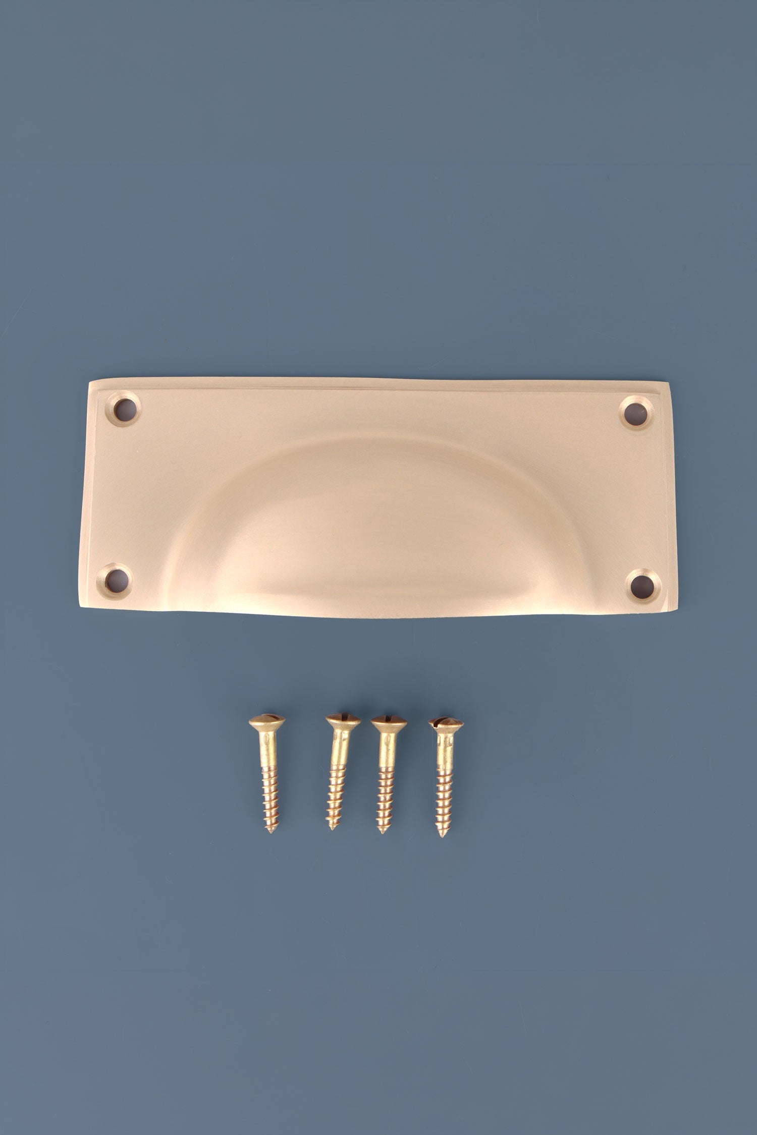 Rounded Plate cup pull in satin brass, lacquered finish