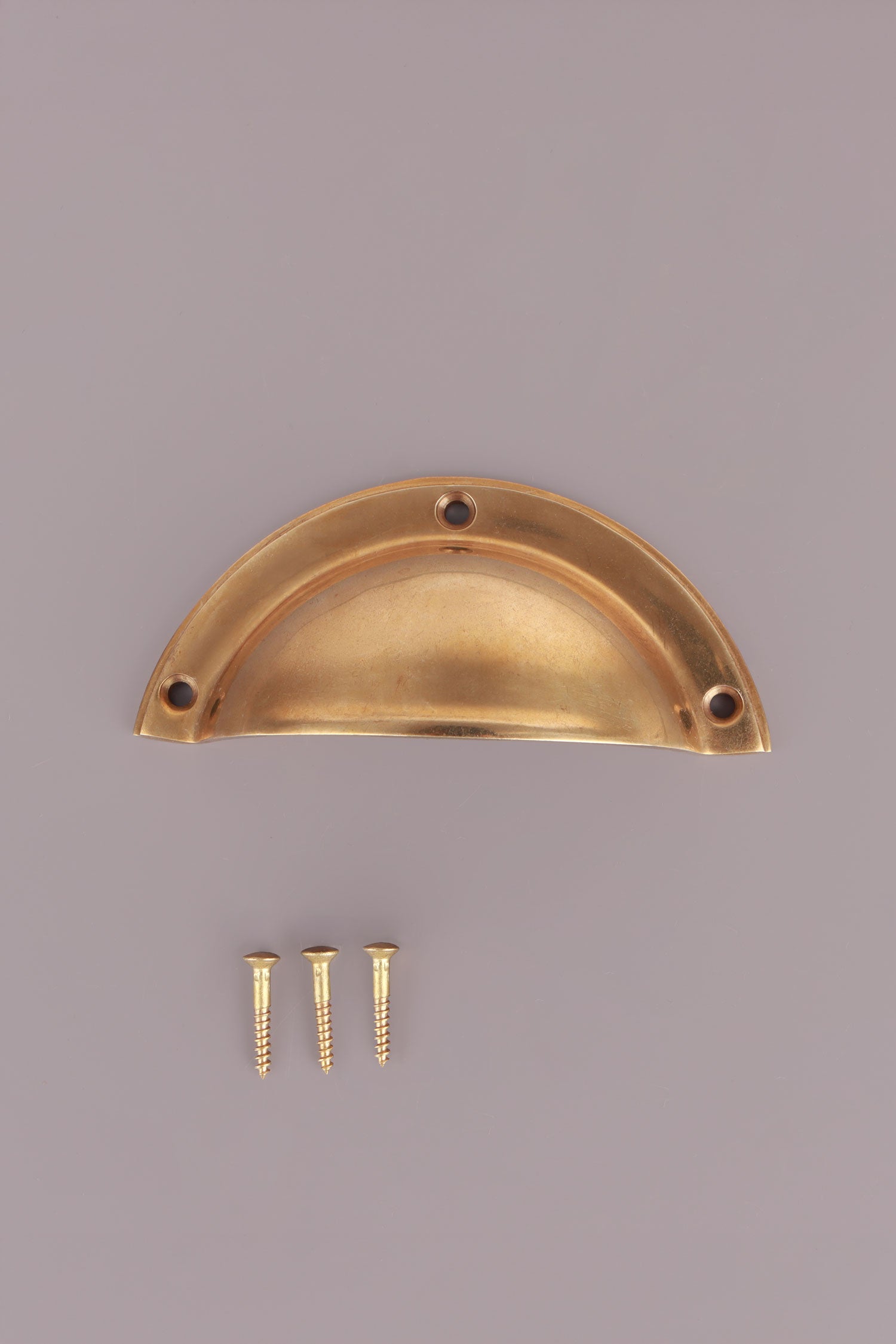 Half Moon cup pull in aged brass, unlacquered living finish