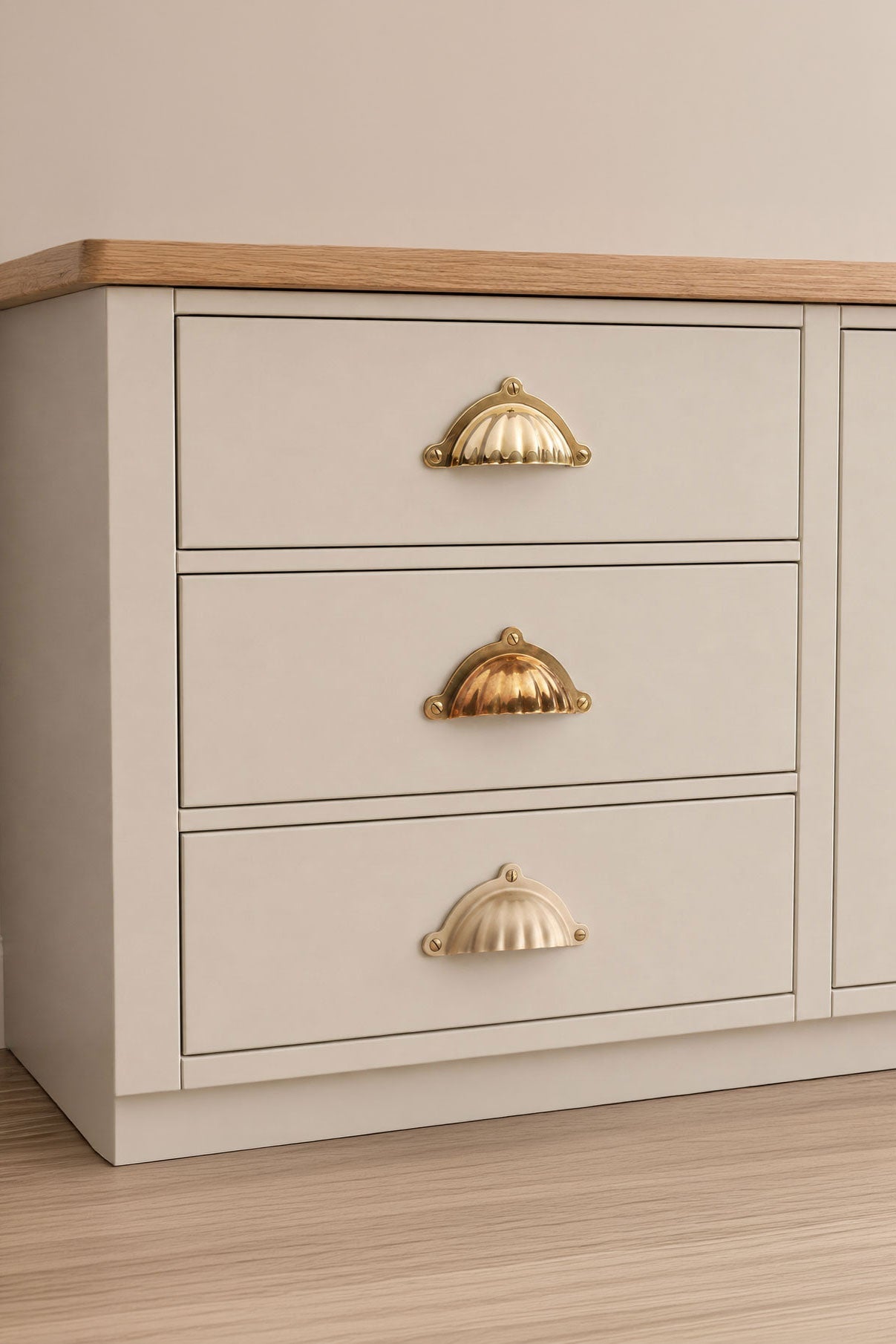Scalloped solid brass cup pull, shown in polished, aged and satin brass