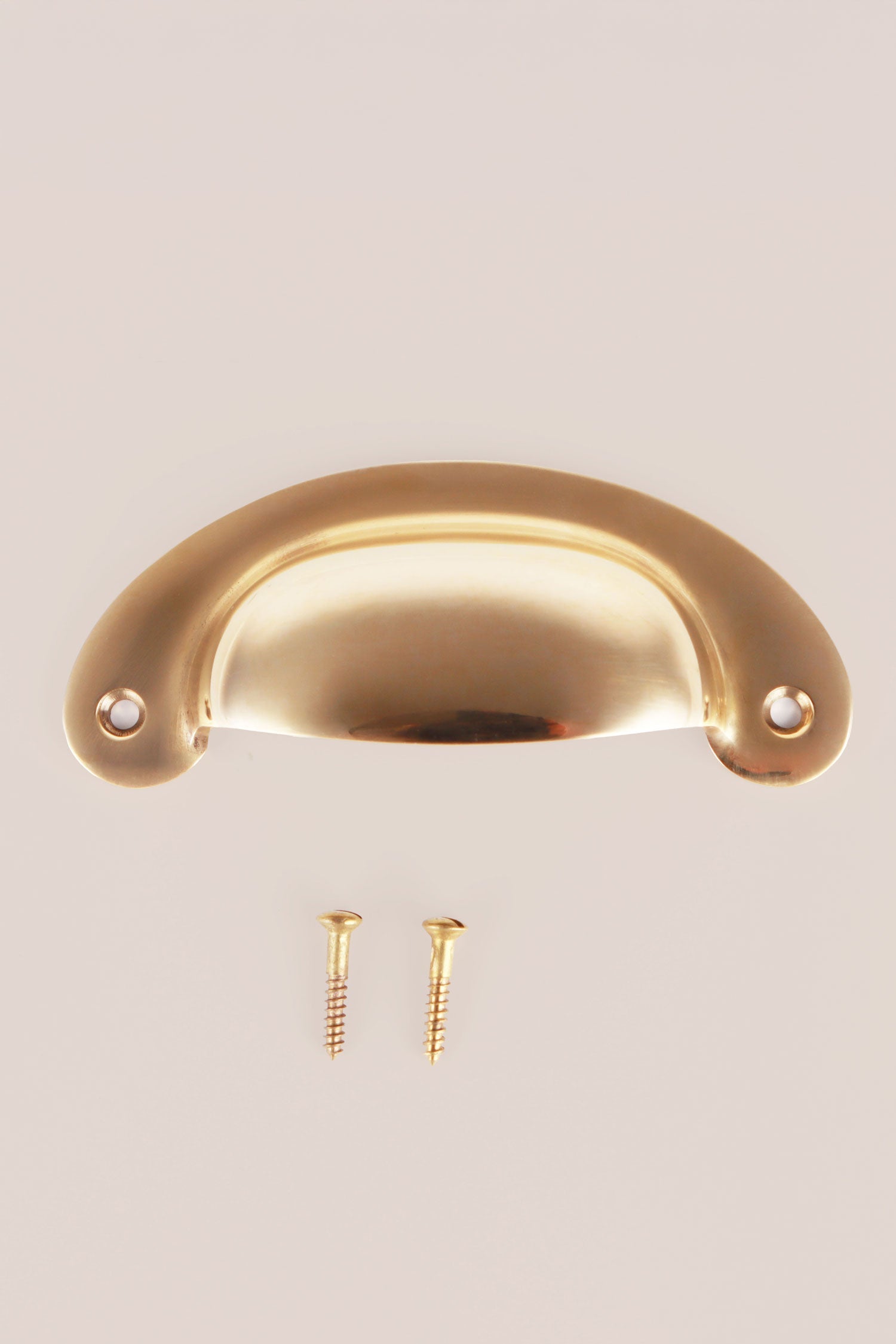 Slim Crescent cup pull in polished brass, unlacquered living finish