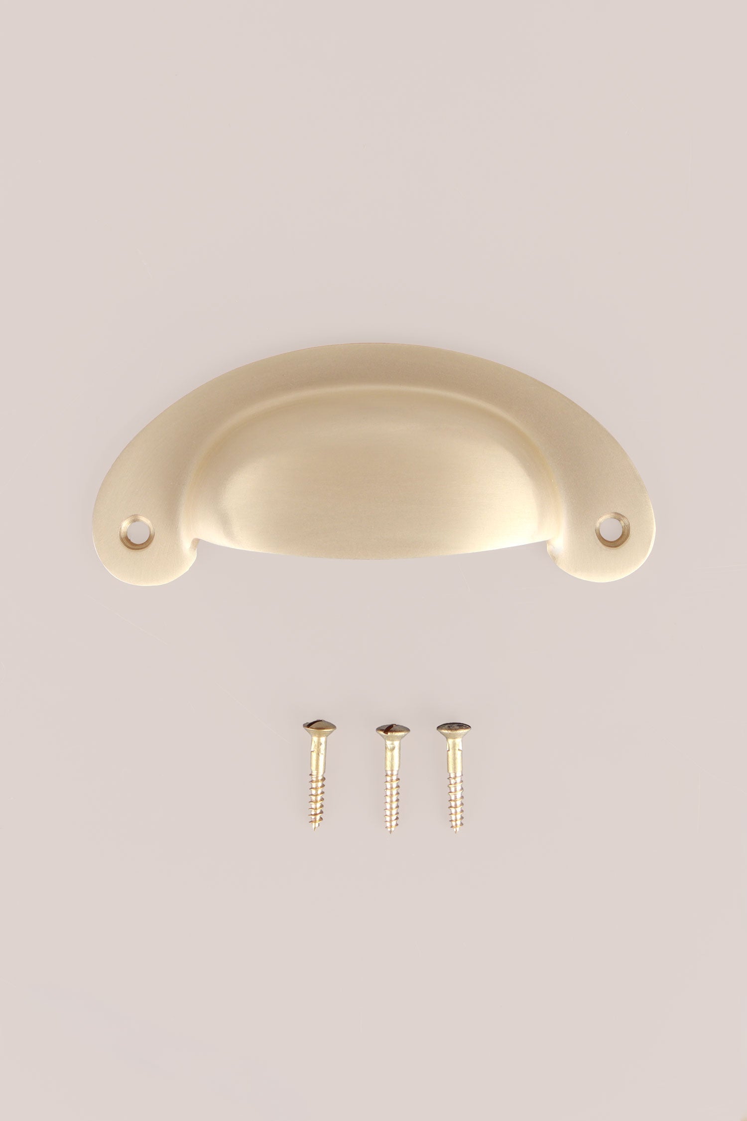 Slim Crescent cup pull in satin brass, lacquered finish