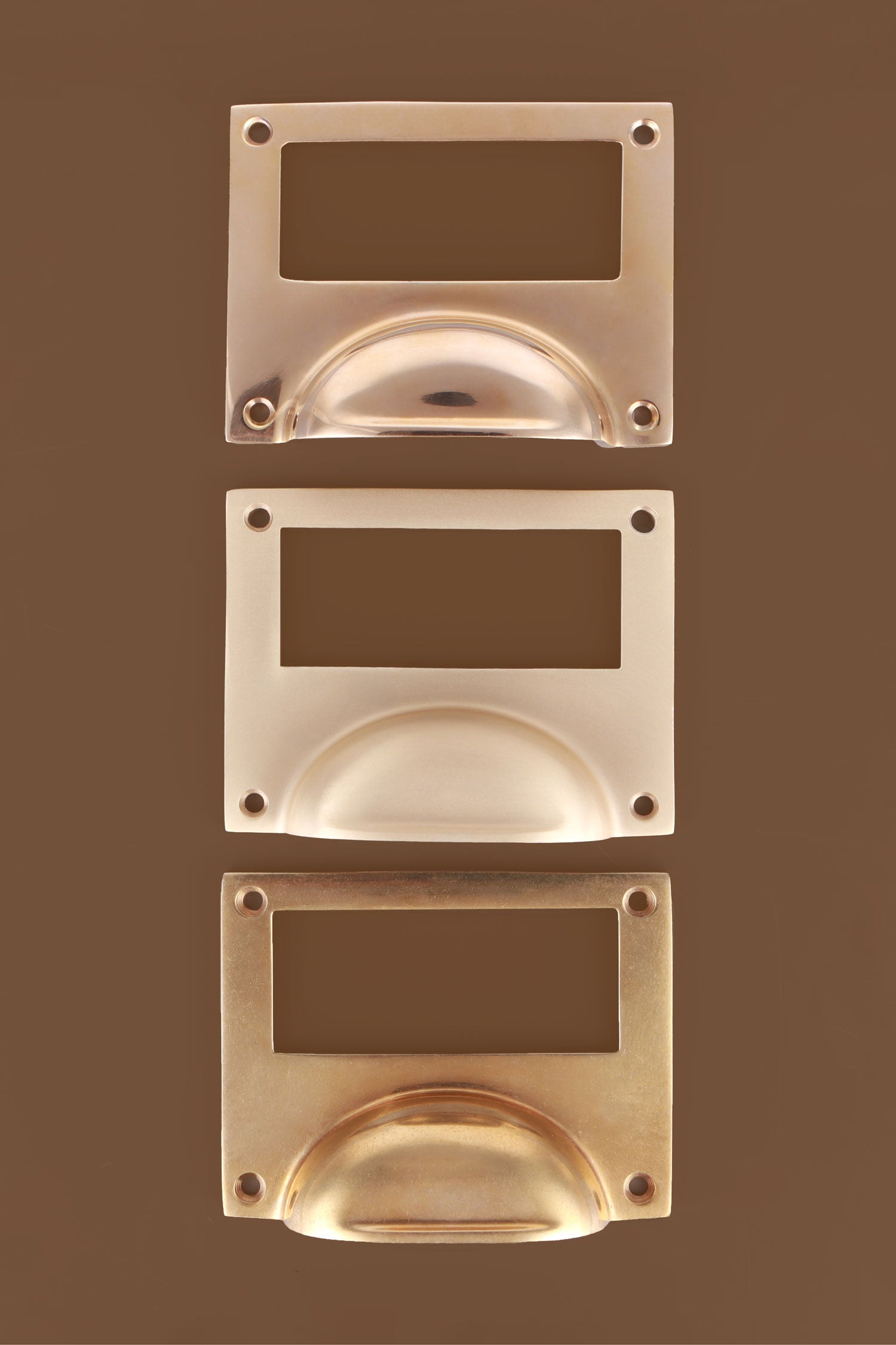 Card frame cup pulls grouped, showing the brass label window