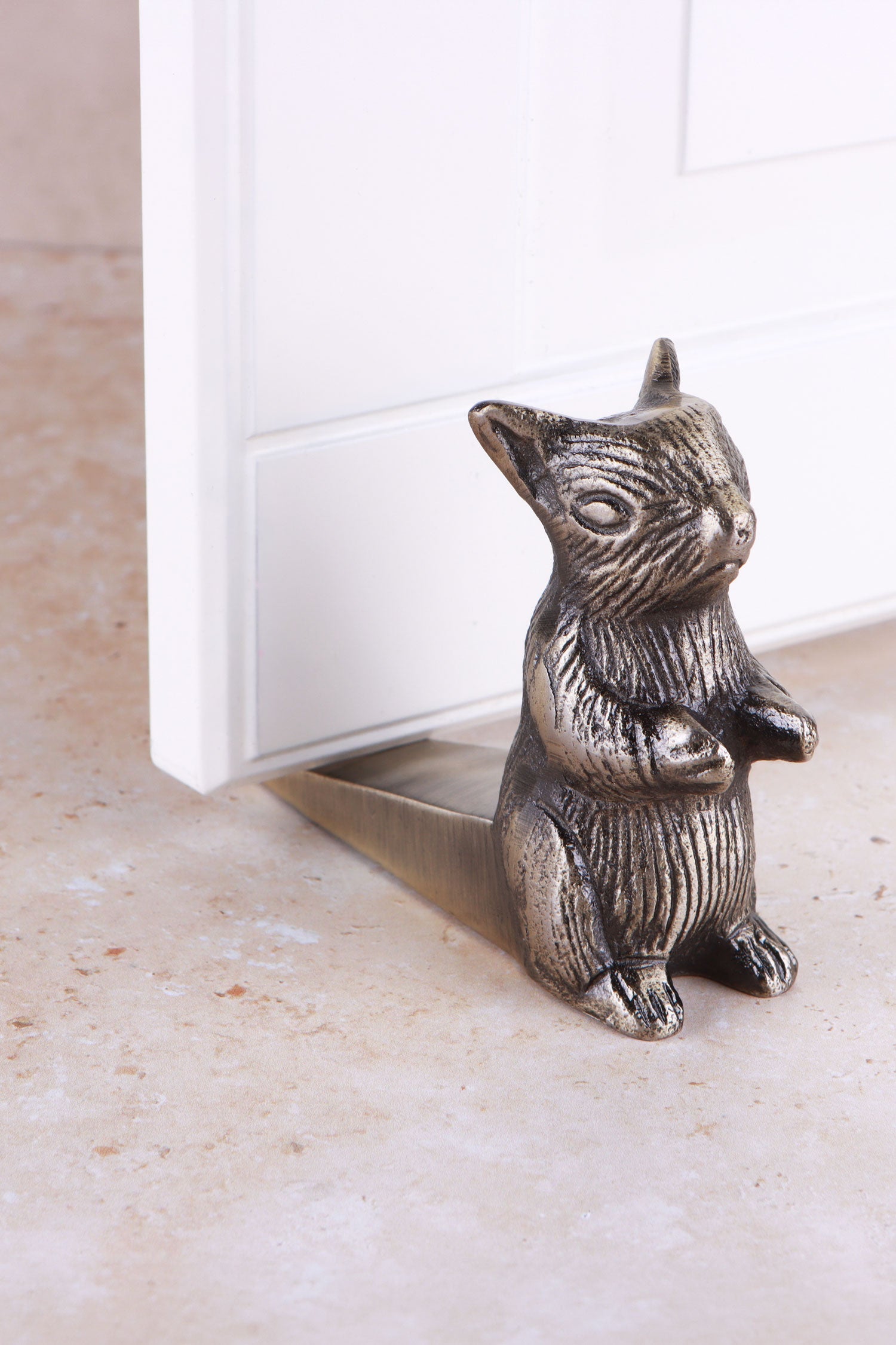Squirrel door stopper in antique brass