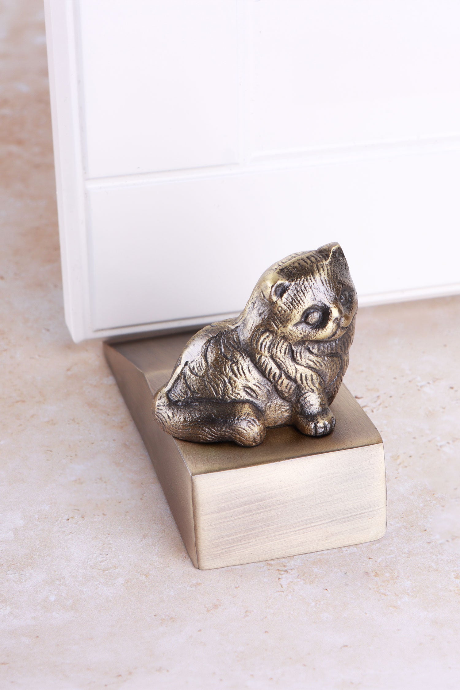 Cat door stopper in antique brass