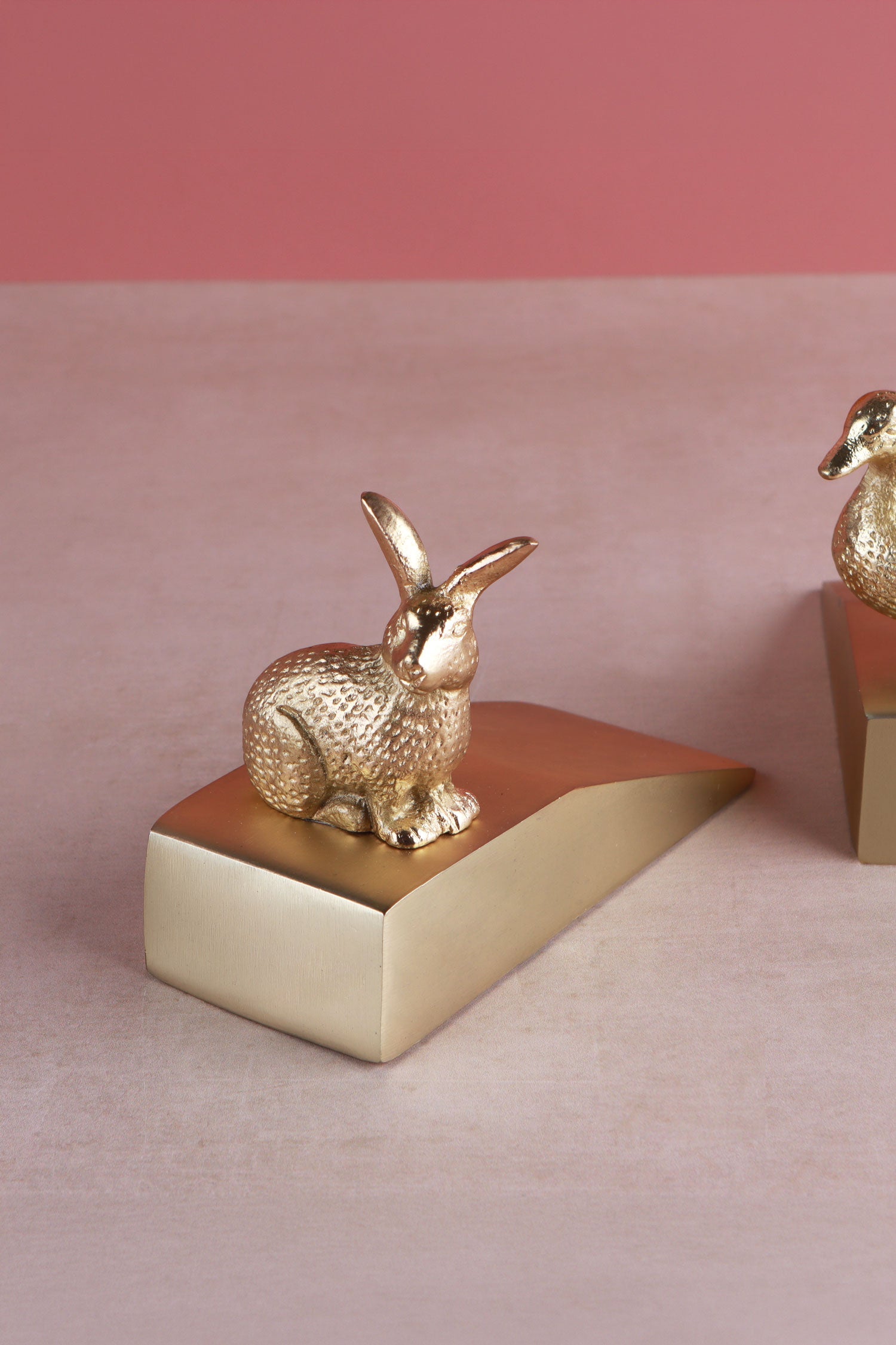 Rabbit door stopper in polished brass