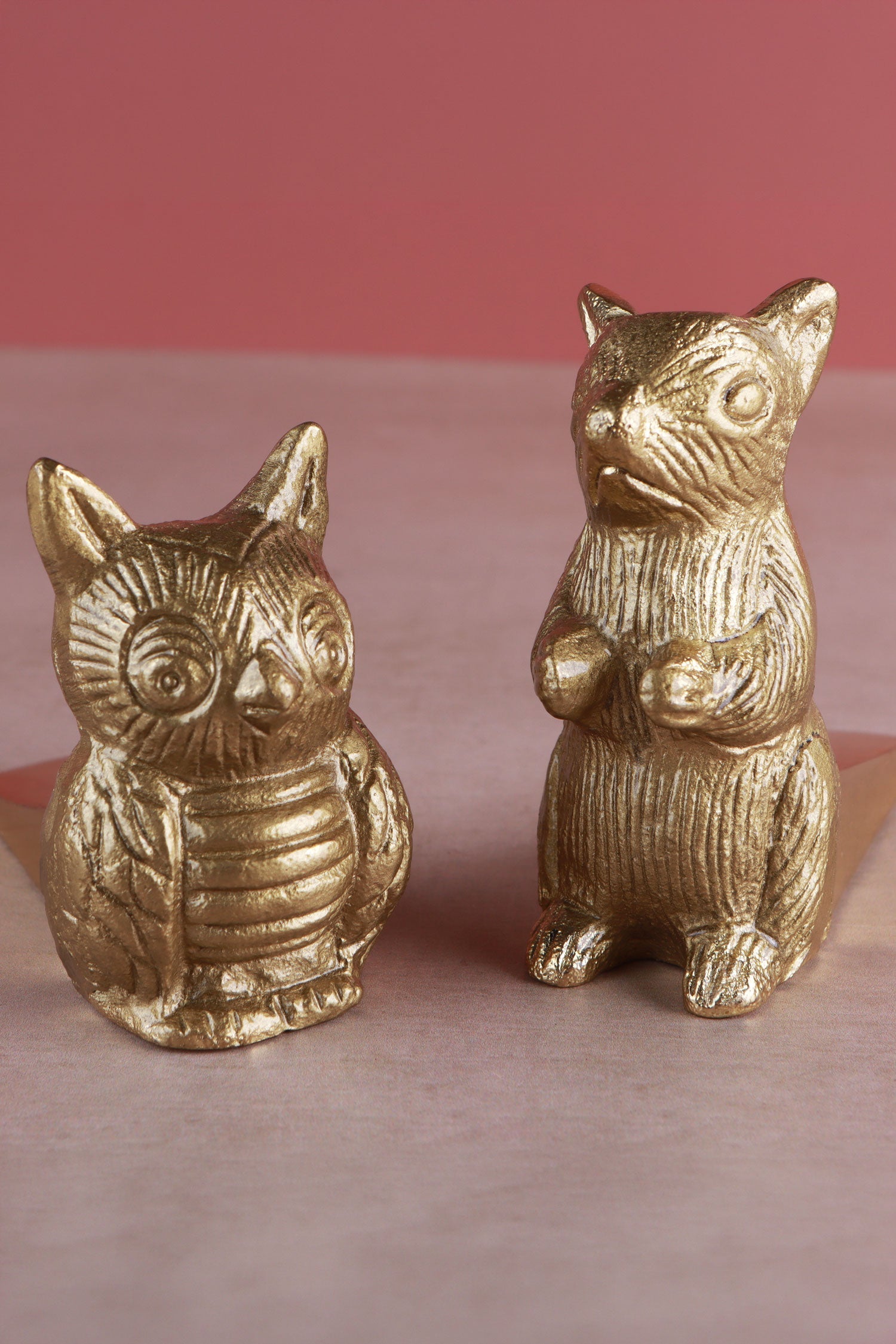 Polished brass Woodland door stoppers holding an interior door