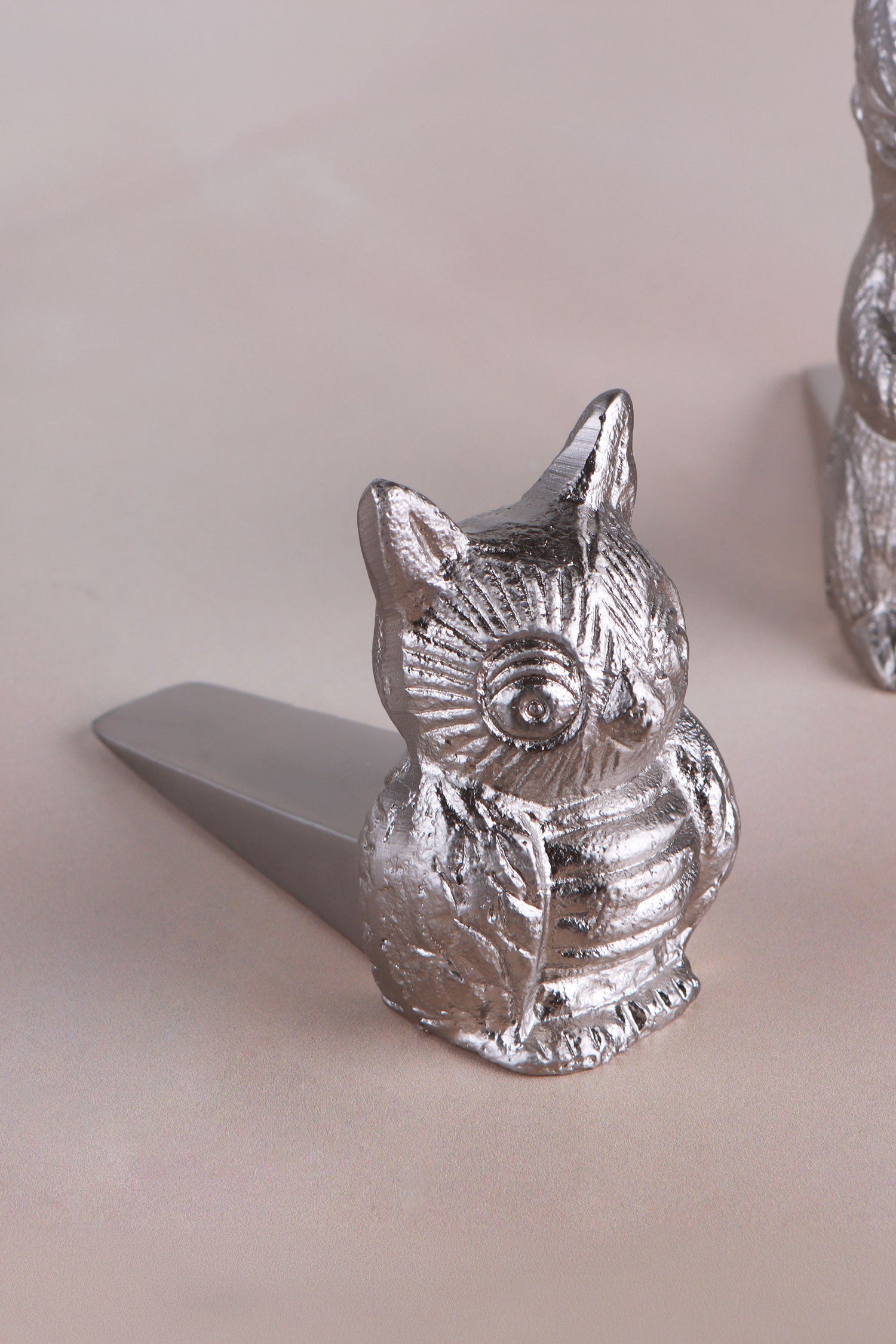 Owl door stopper in chrome