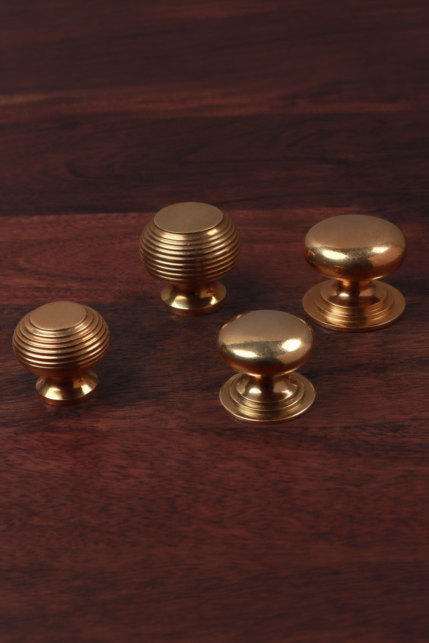 Aged brass cabinet knobs shown together