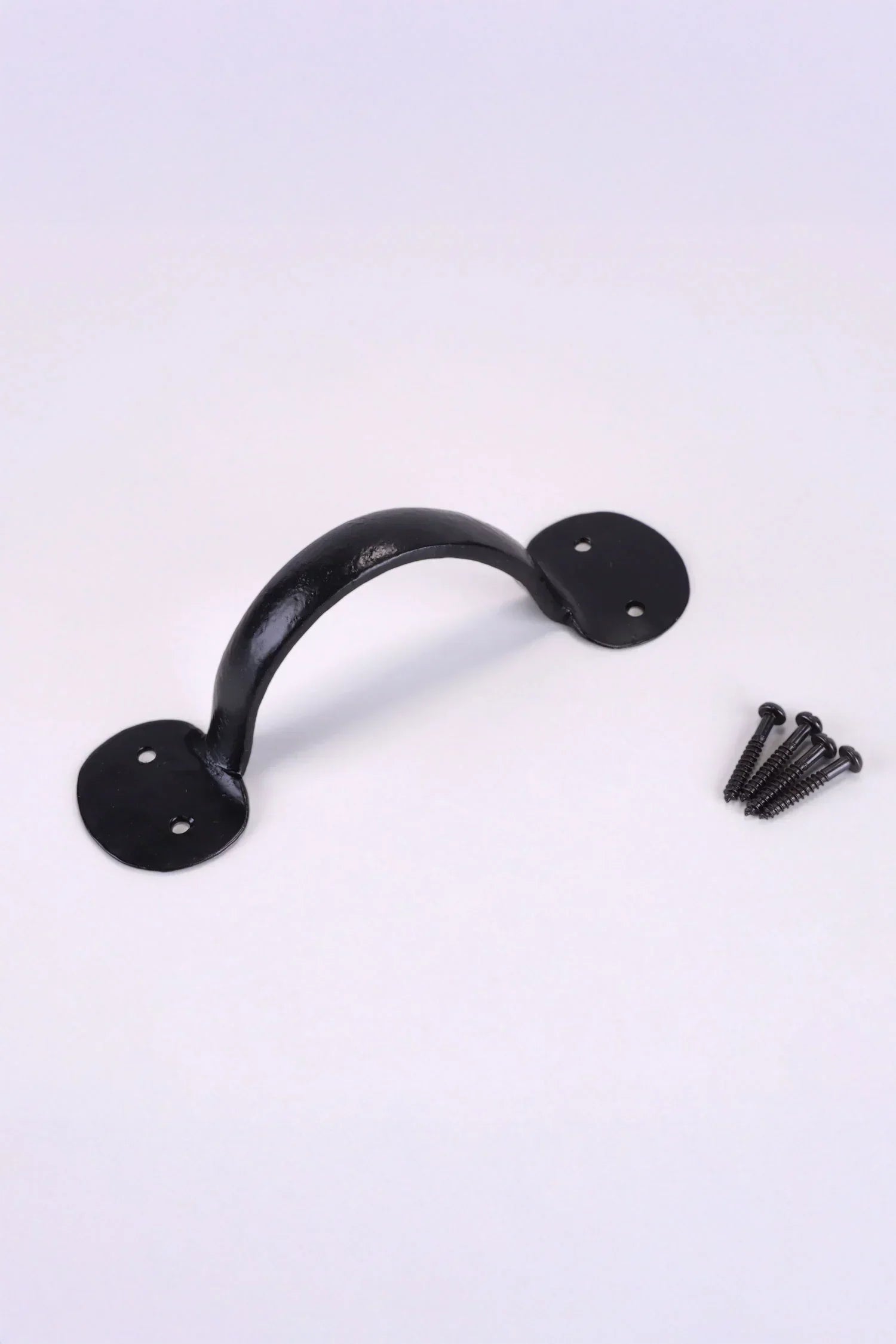 Black metal hardware handle with mounting screws on a white background, G Decor