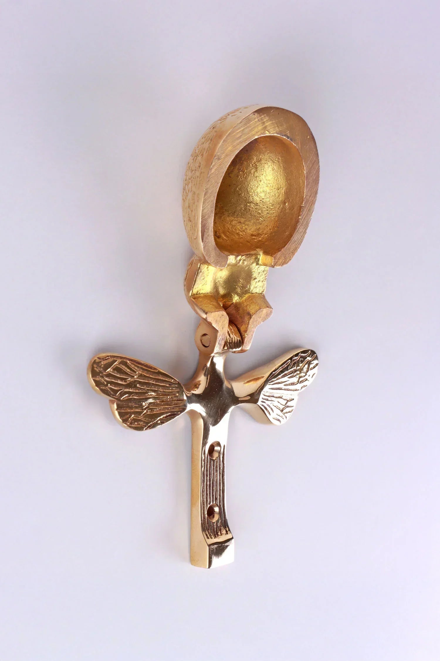 Gold angel-shaped wall hook with textured wings by G Decor, luxury hardware accessory.