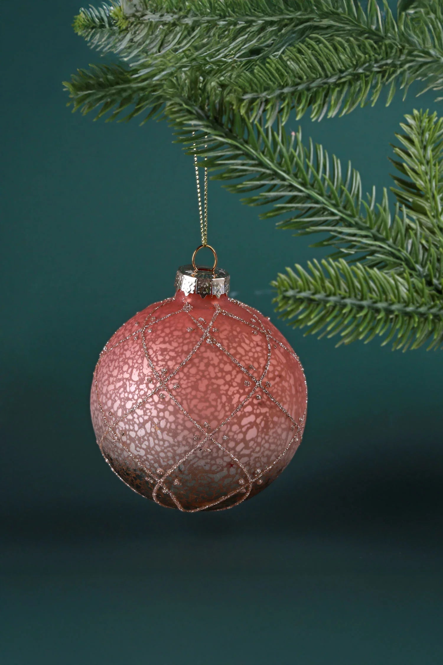 Luxury pink Christmas ornament with glitter accents hanging on a pine branch, G Decor