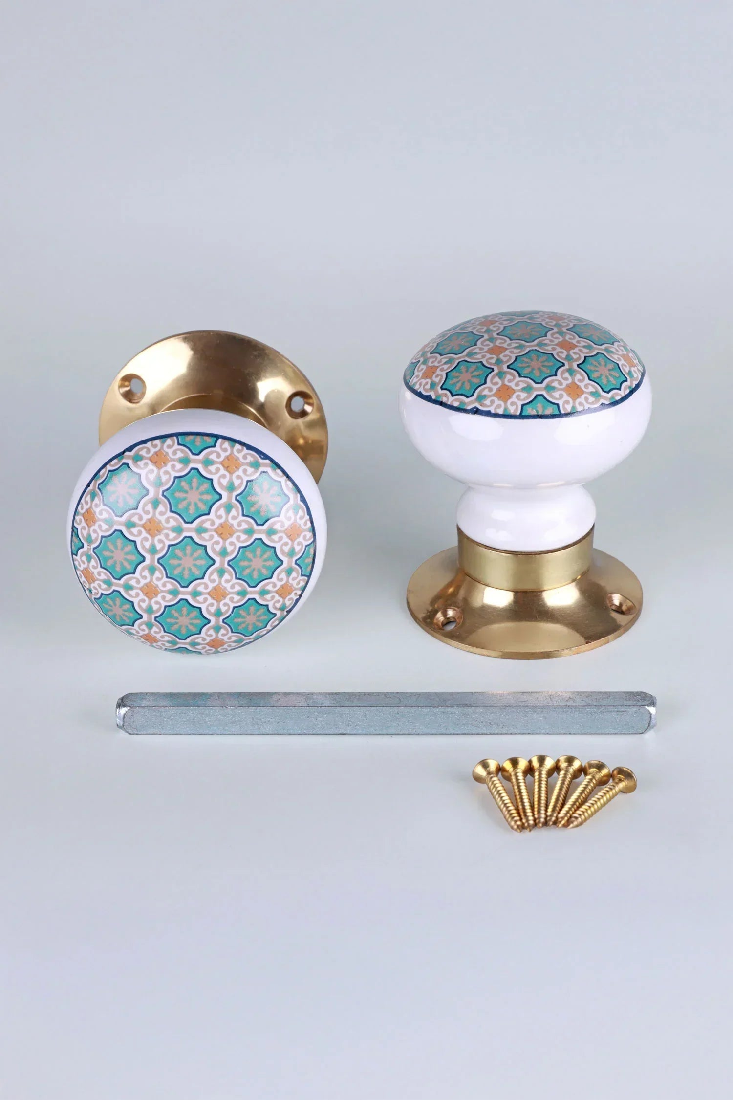 Pair of G Decor luxury ceramic door knobs with gold base, geometric pattern, screws included