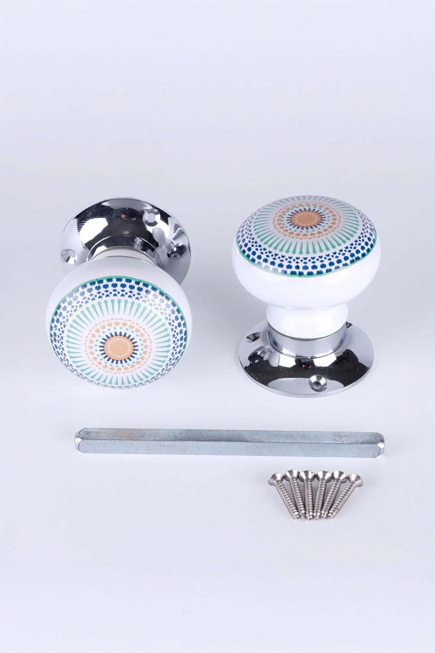G Decor luxury ceramic door knobs with mandala pattern, chrome bases, and installation hardware
