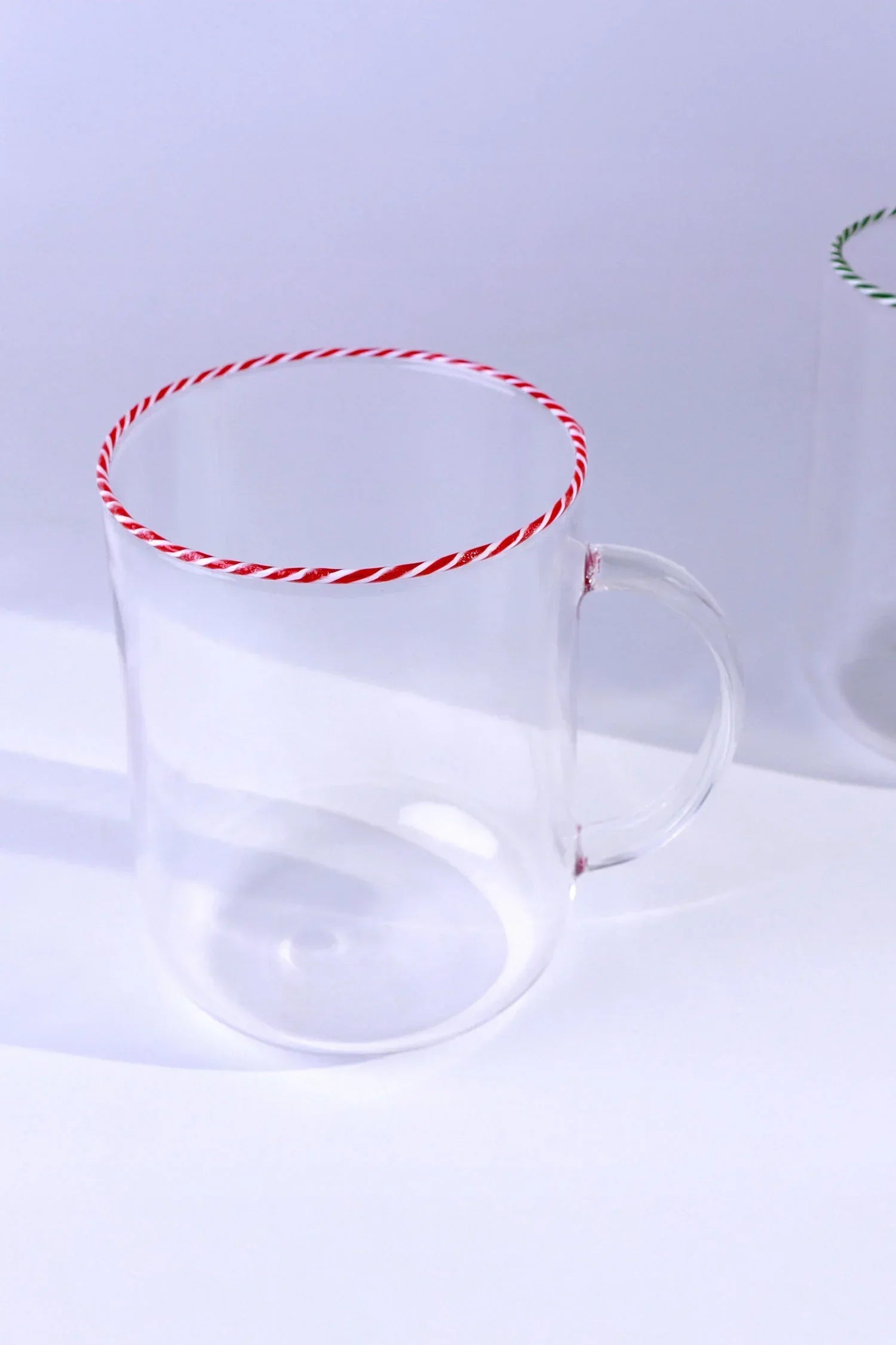 Clear glass mug with red and white striped rim, modern luxury tableware by G Decor