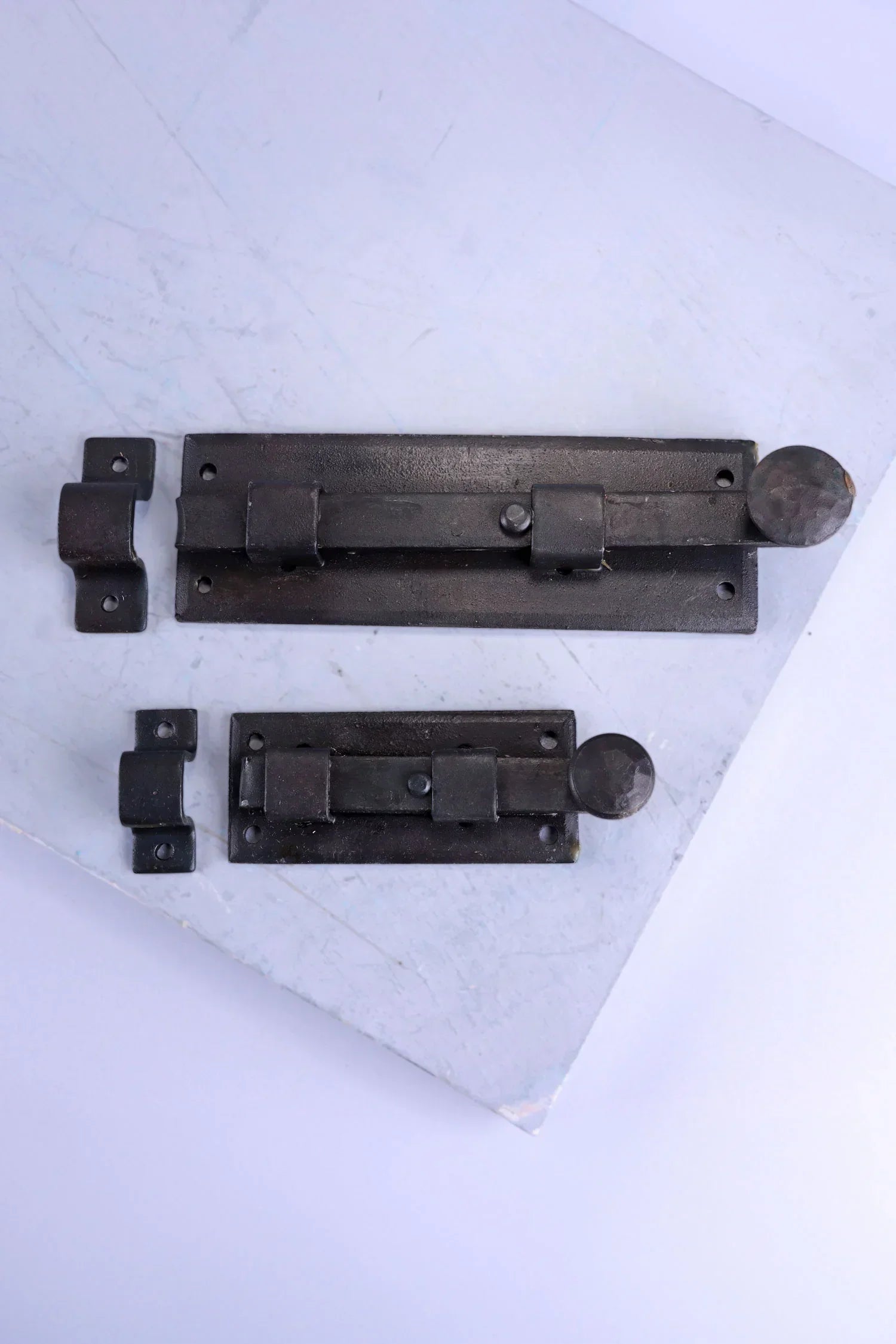 Hand-Forged Hammered Iron Sliding Door Bolt, Beeswax — close-up view, G Decor