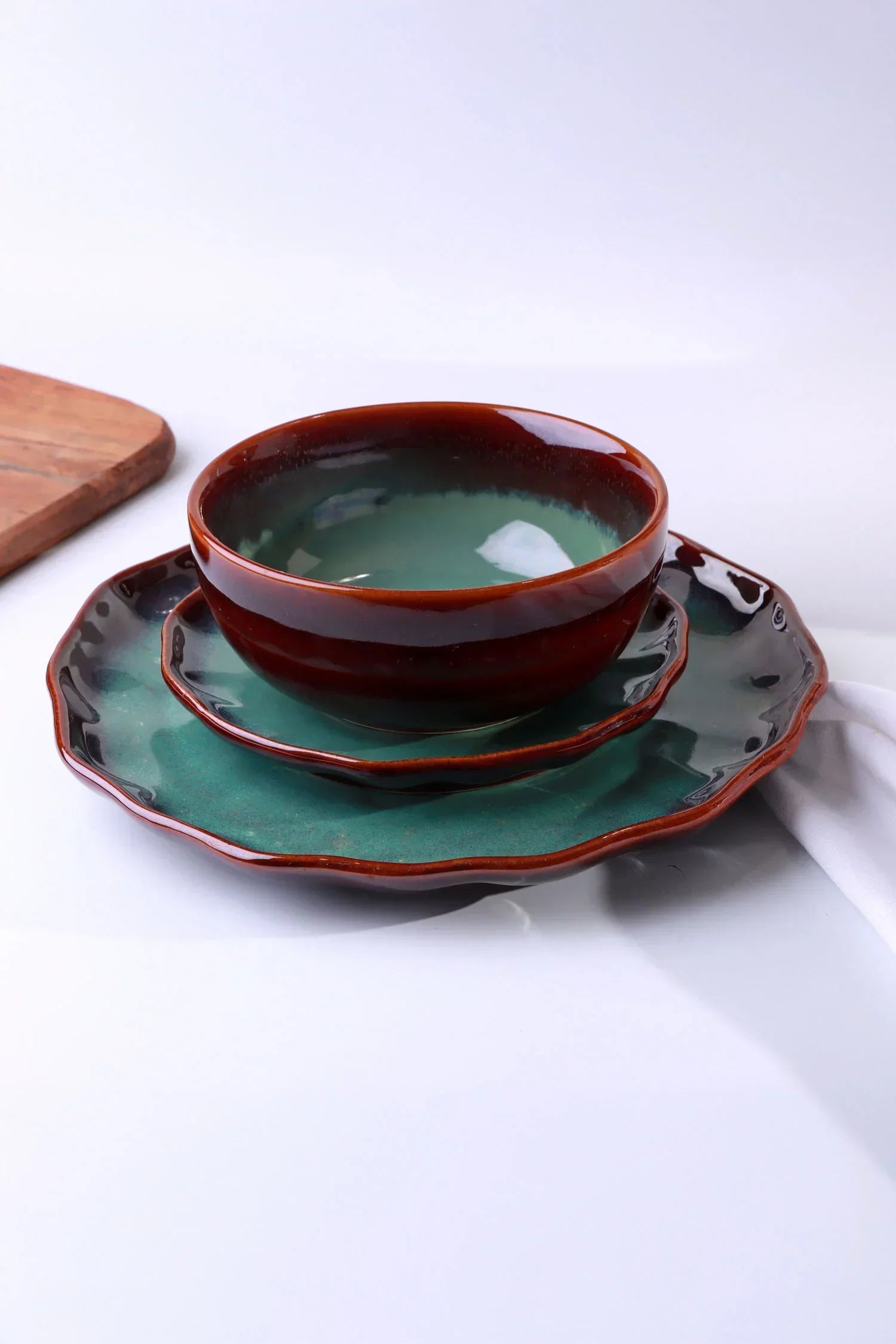 G Decor luxury tableware set with green and brown ceramic bowl and plates on white background