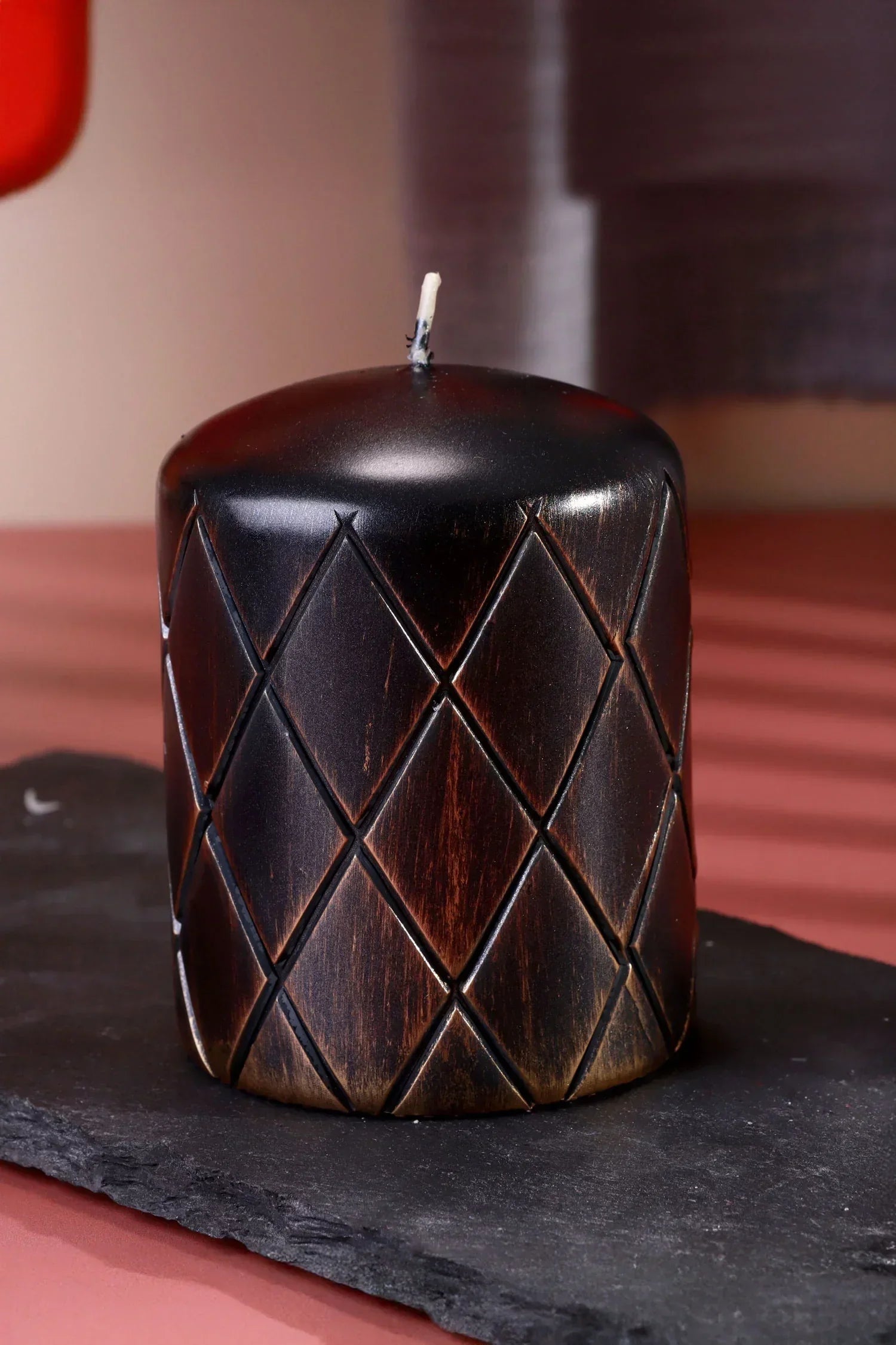 Gold Lattice Noir Bronze Monstera Relief Pillar Candle — close-up view, G Decor