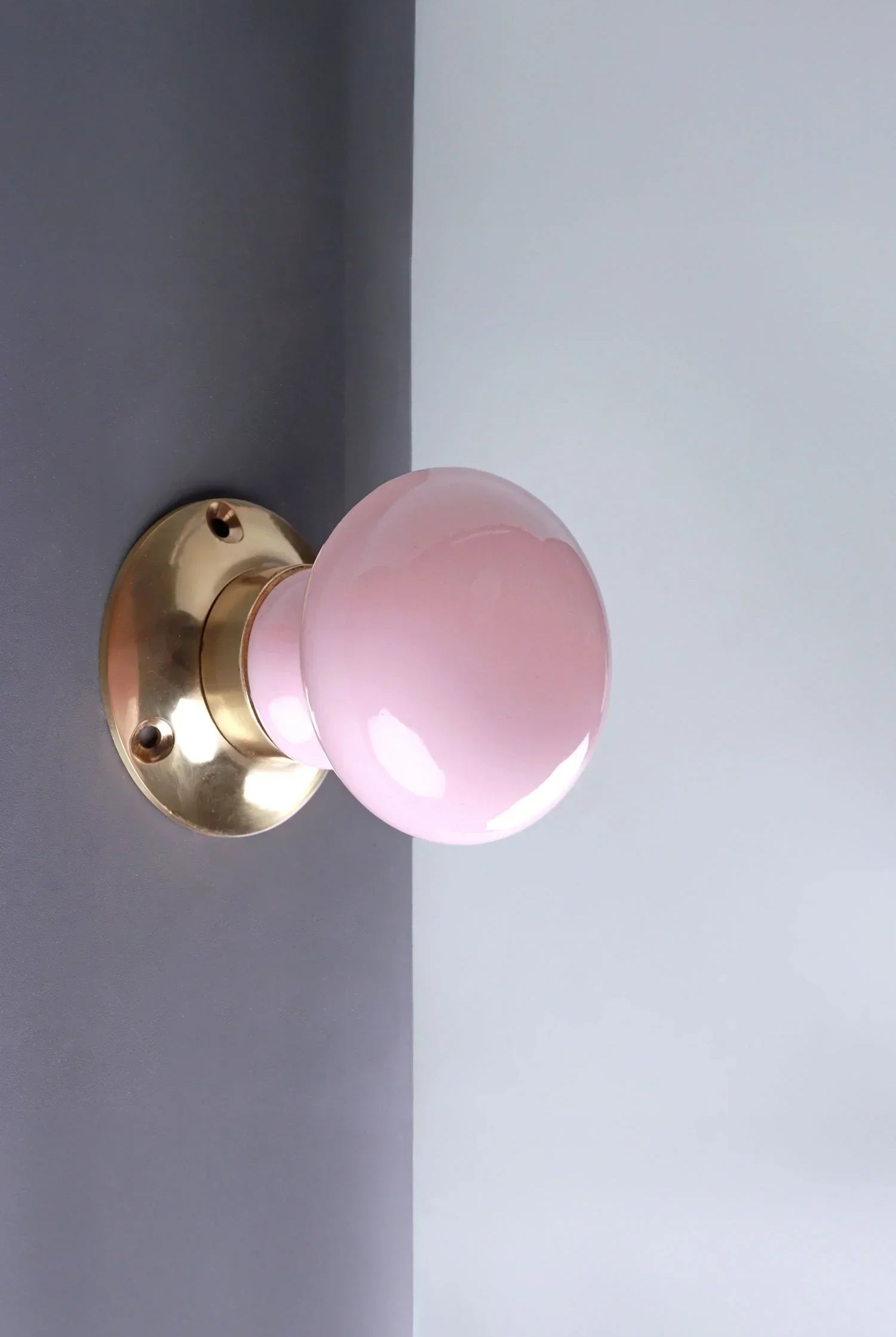 G Decor luxury pink ceramic and brass door knob on grey door