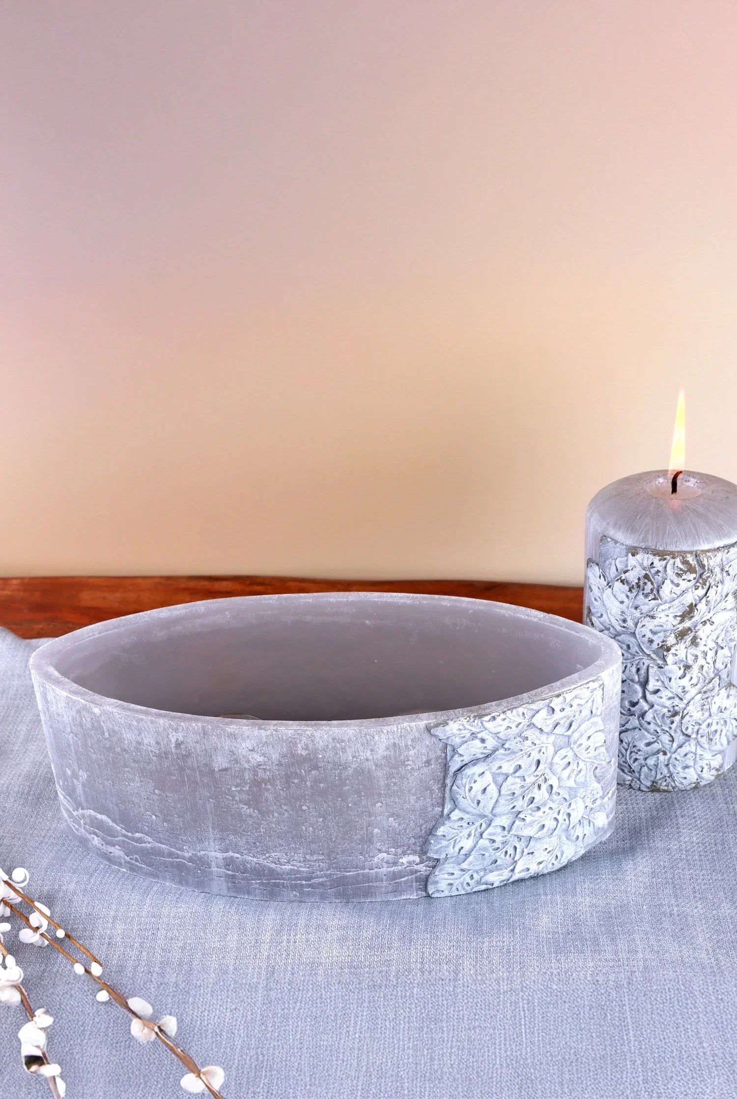 Luxury grey decorative bowl and textured candle on soft fabric, G Decor home accessories