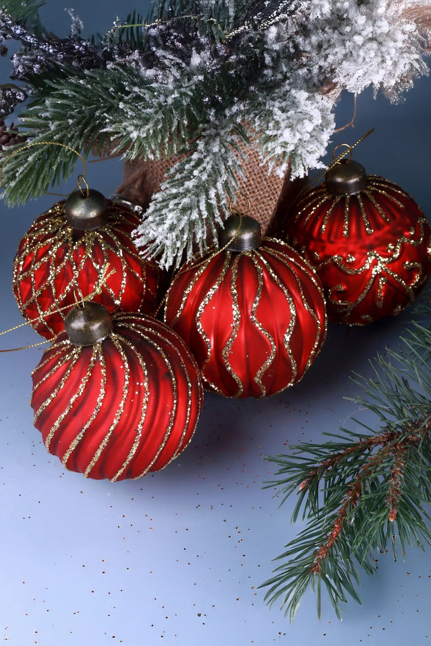 Luxury red and gold Christmas baubles under frosted pine branches, G Decor holiday décor