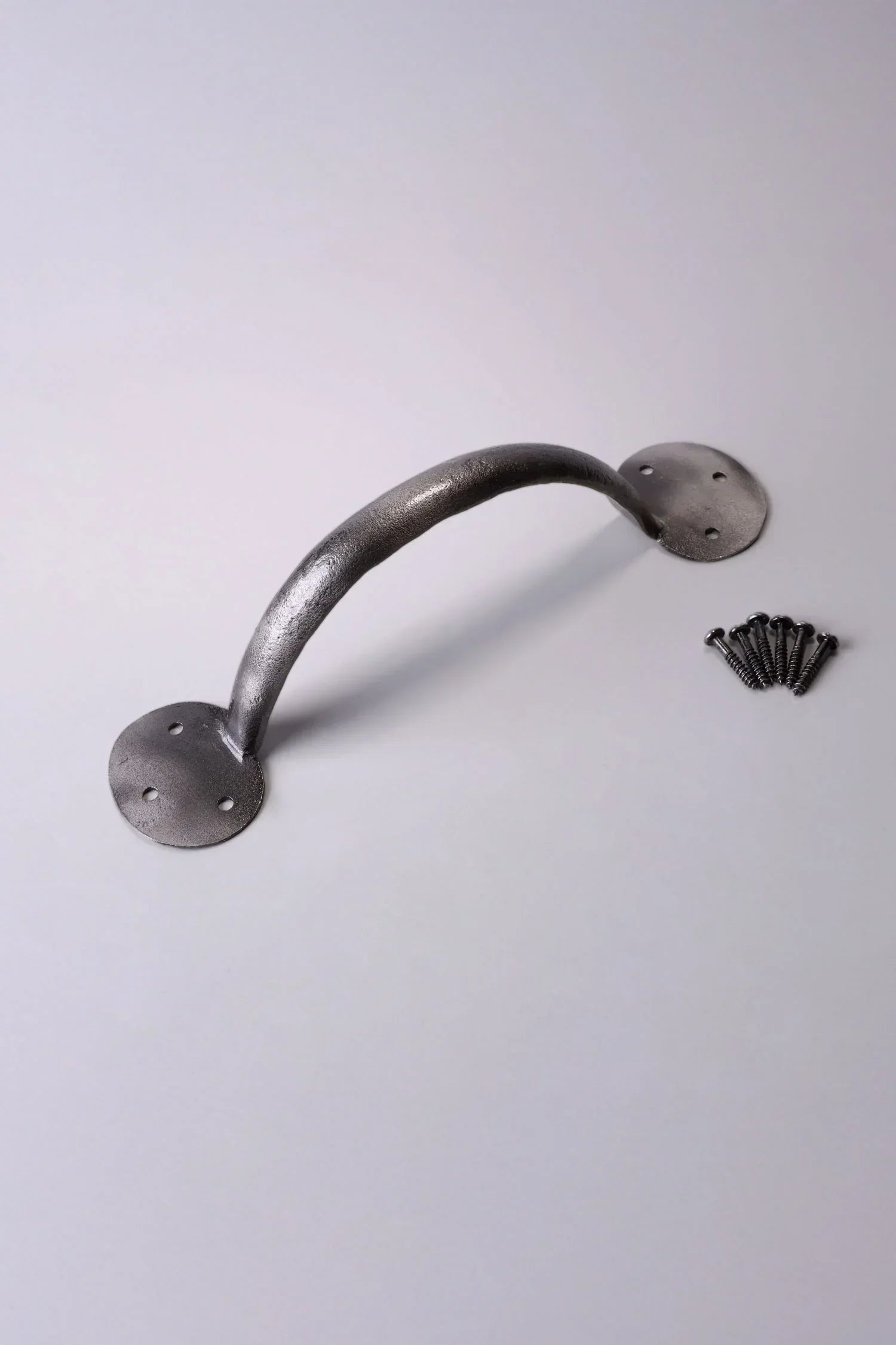 Metal door pull handle with screws, luxury hardware by G Decor on light background