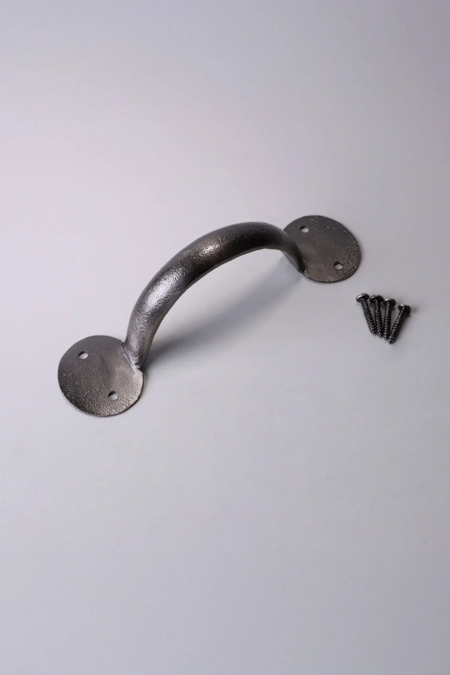 Metal cabinet pull handle with mounting screws on white background, luxury hardware by G Decor