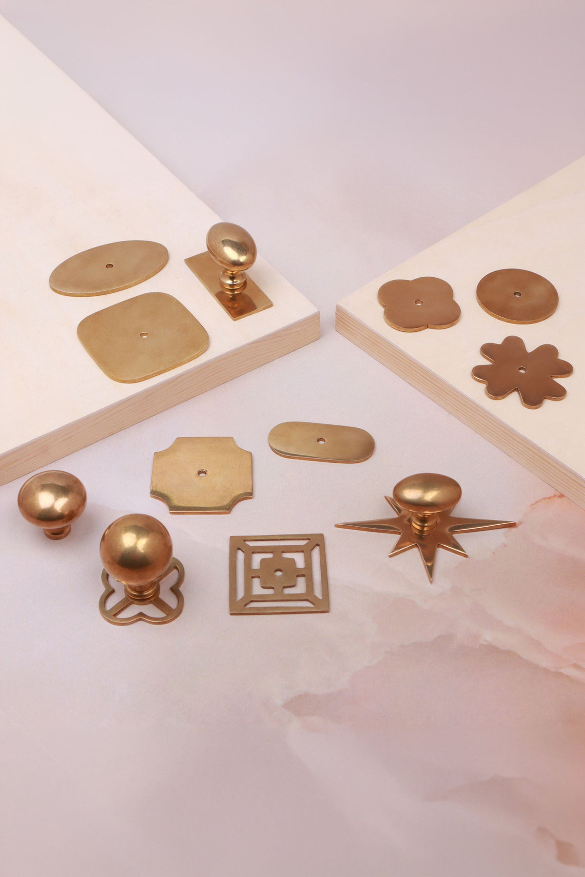 Cabinet knobs and backplates in aged brass, third view