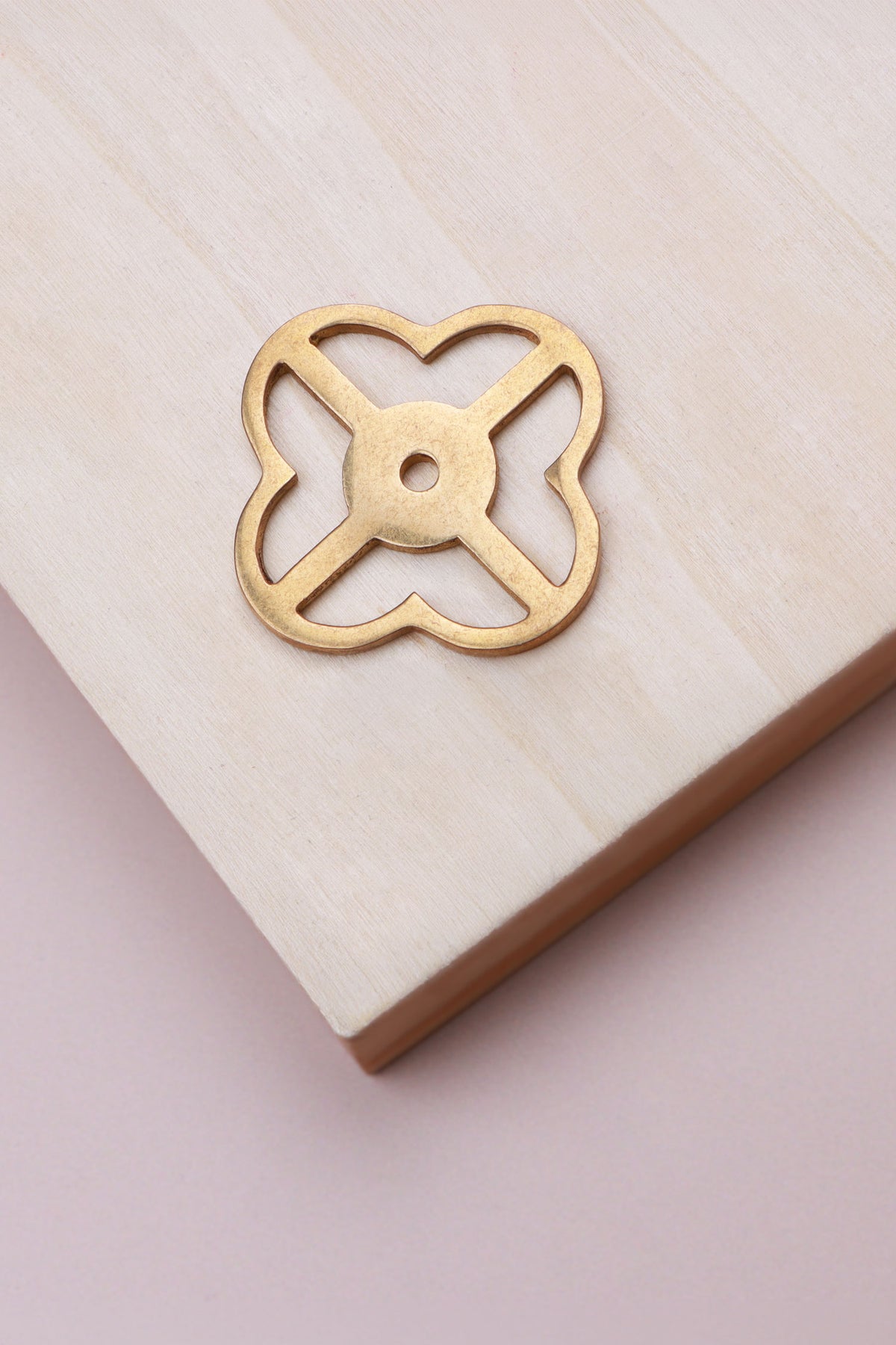 Aged brass pierced backplate, 38 x 38mm, an open quatrefoil: solid brass with a 4mm centre hole for the knob bolt