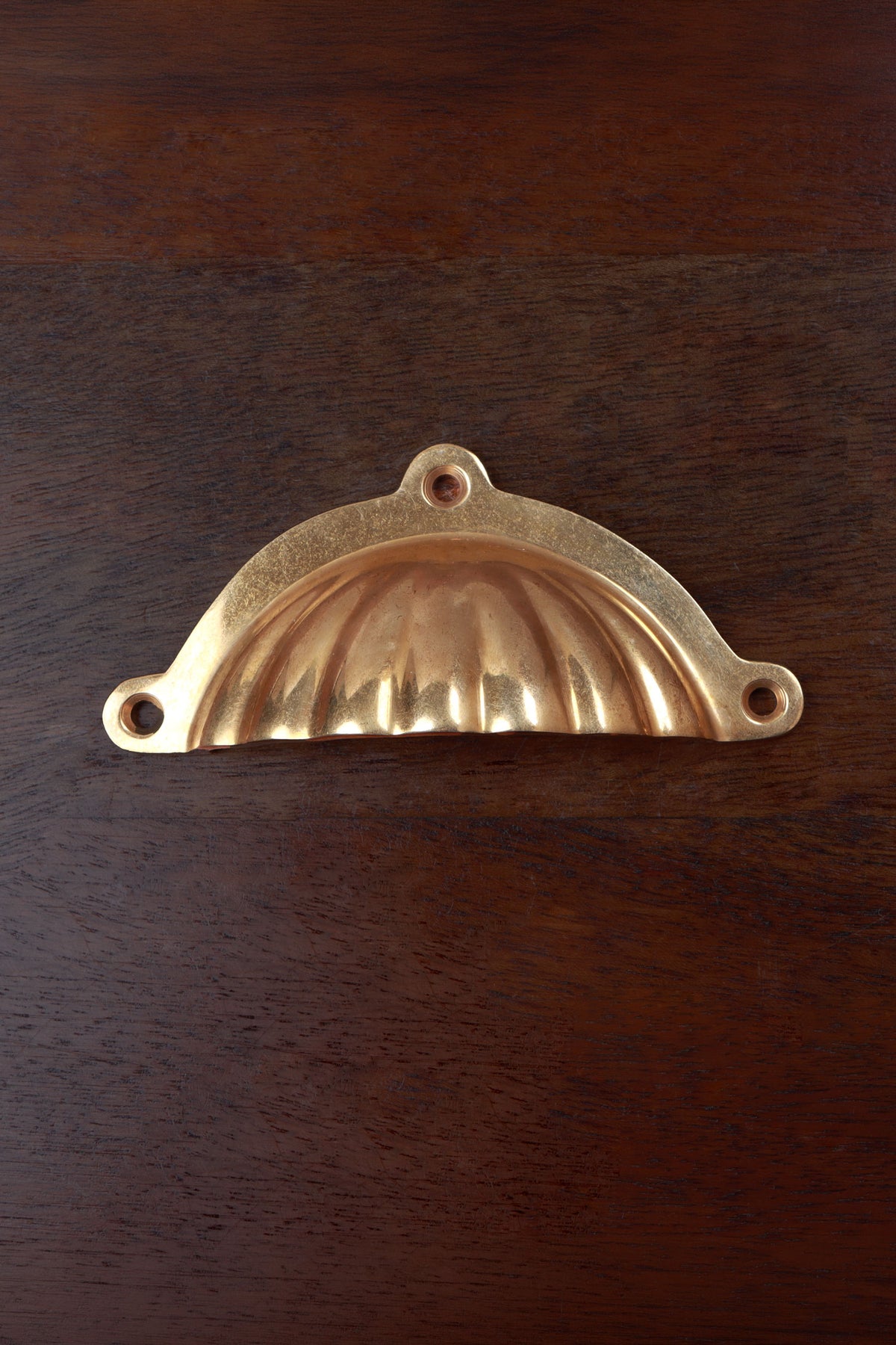Scalloped aged brass cup pull with three fixing lugs