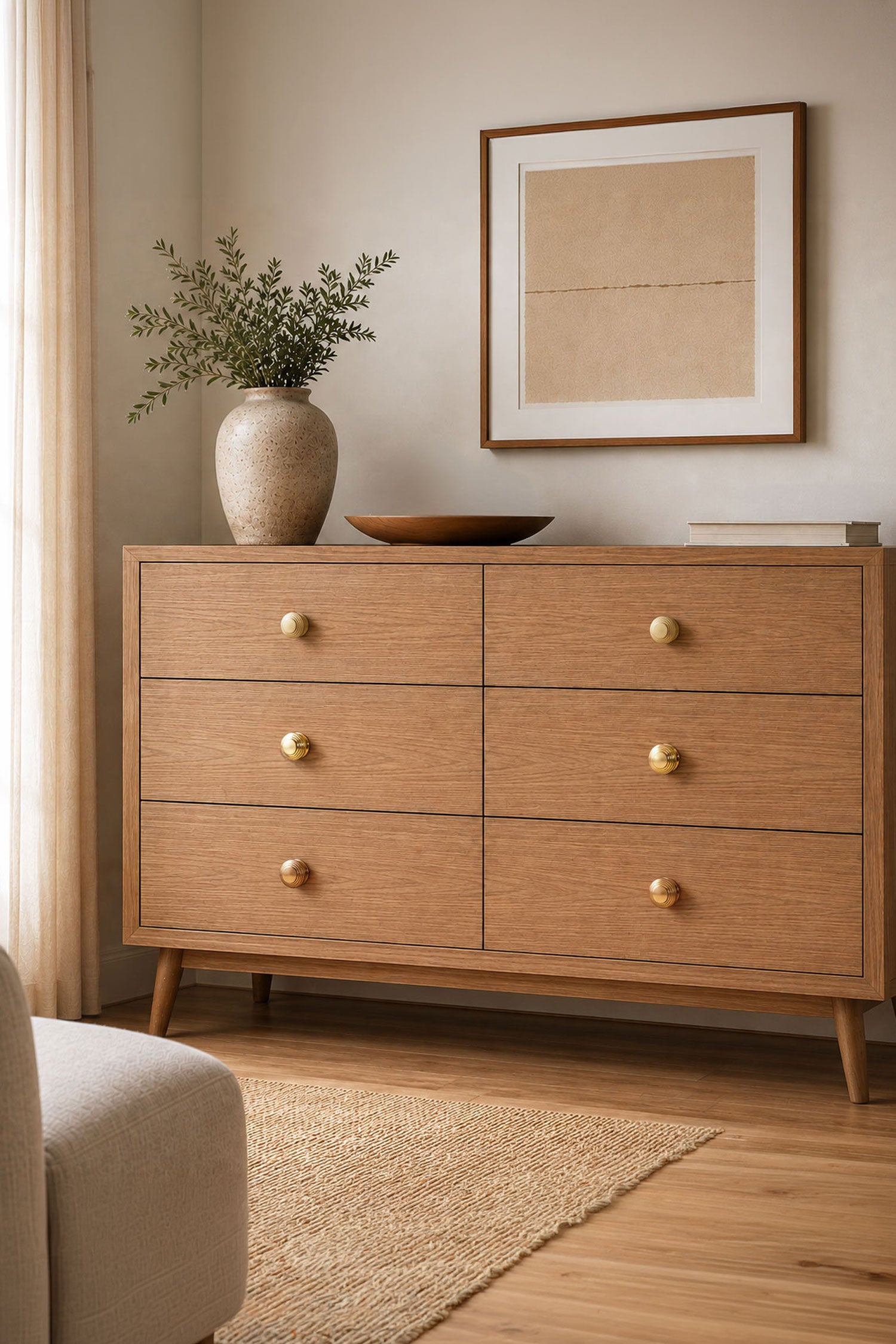 Beehive brass cabinet knobs fitted to an oak chest of drawers