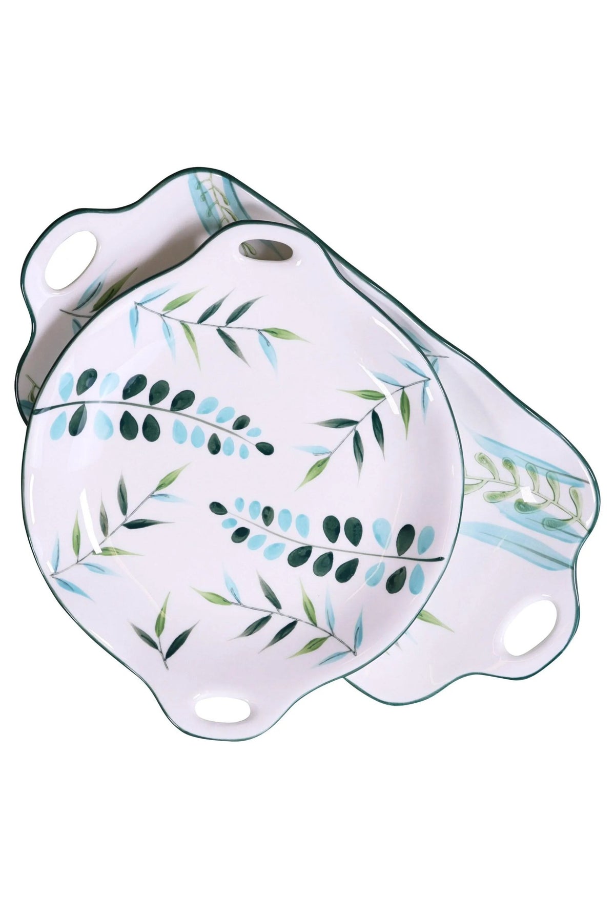 The round leaf plate resting on the long platter, on a white background