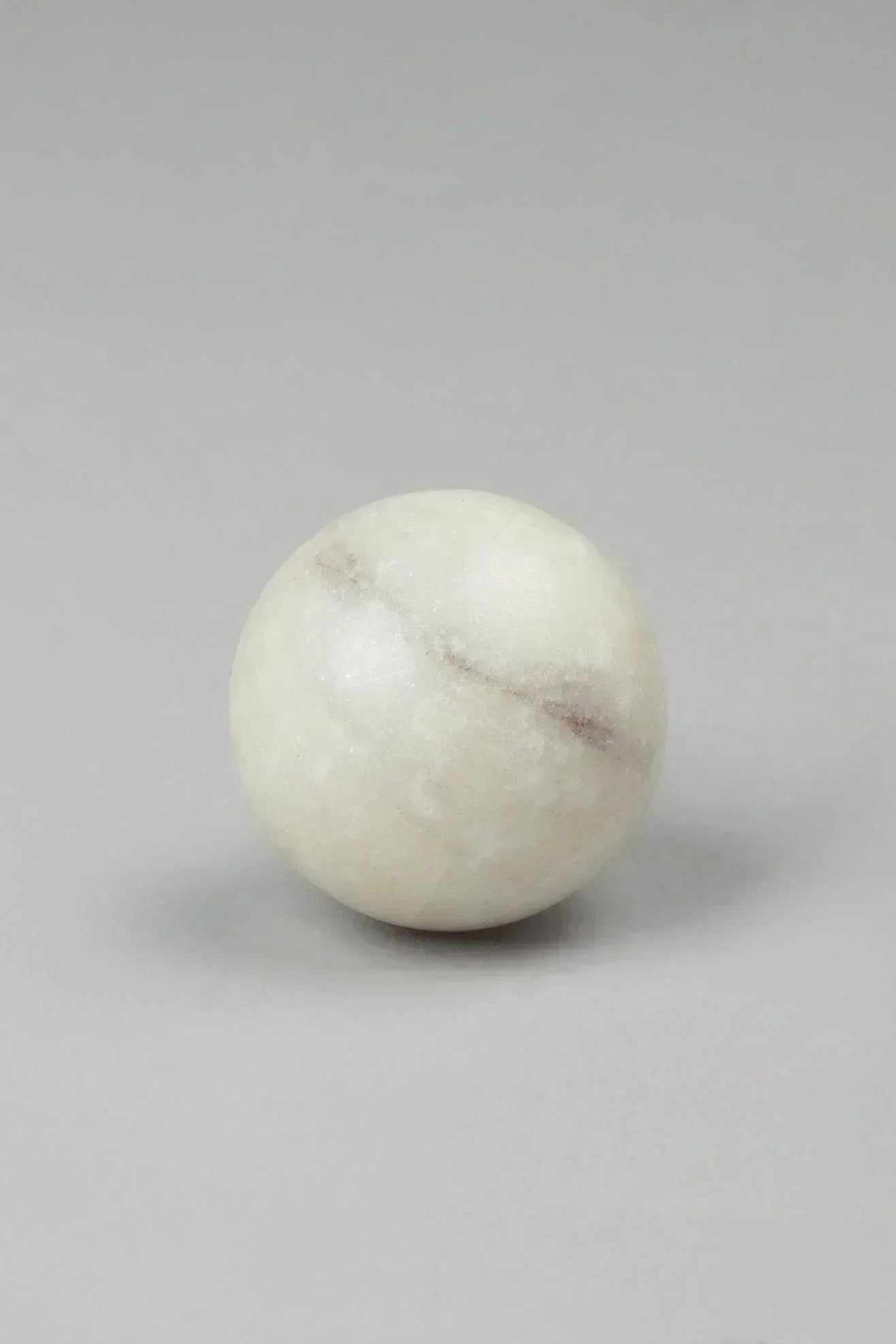 White marble cabinet knob close-up showing natural veining — G Decor