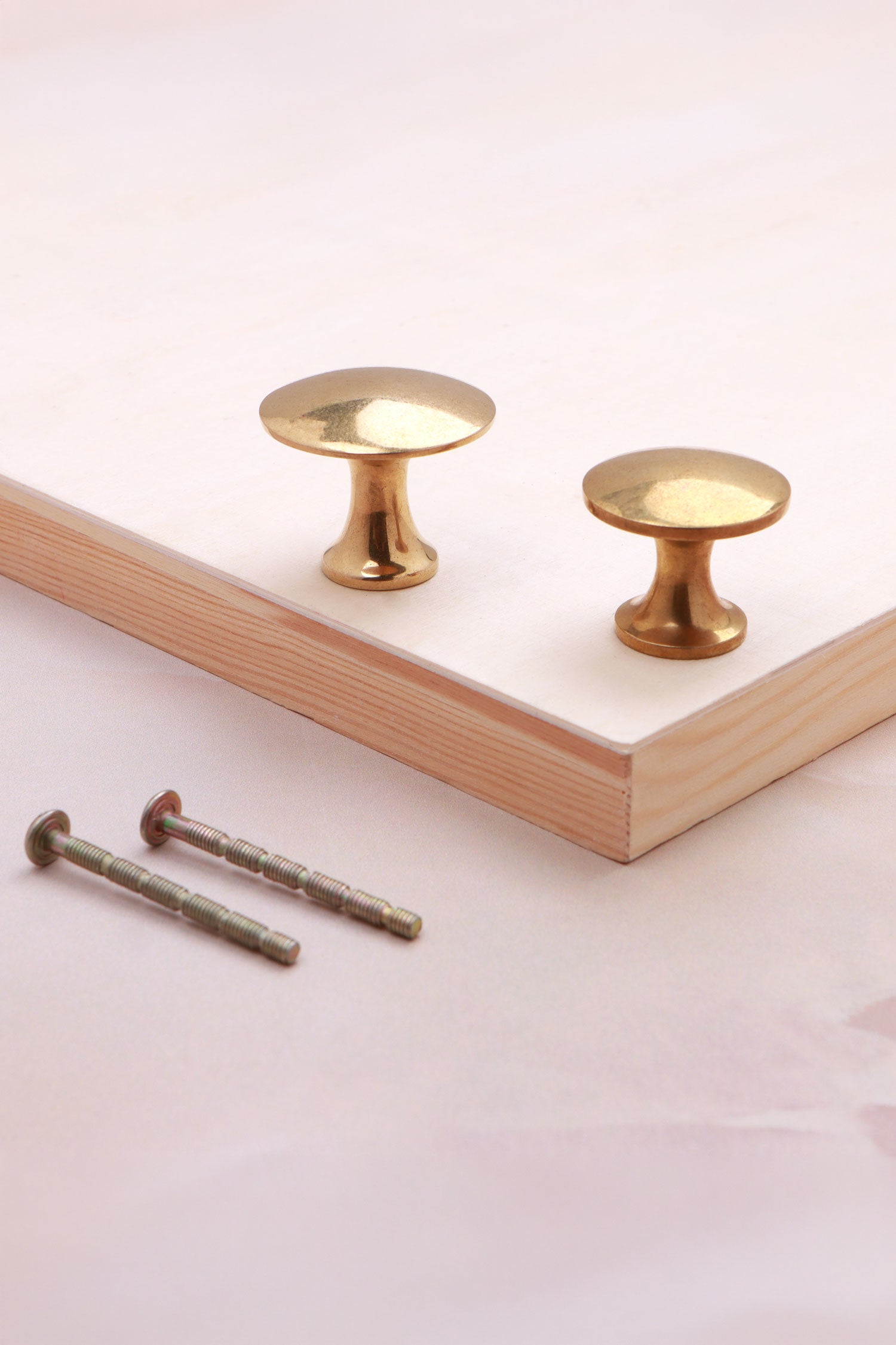 Flat cabinet knob in aged brass, 32mm and 38mm, with solid brass fixing bolts