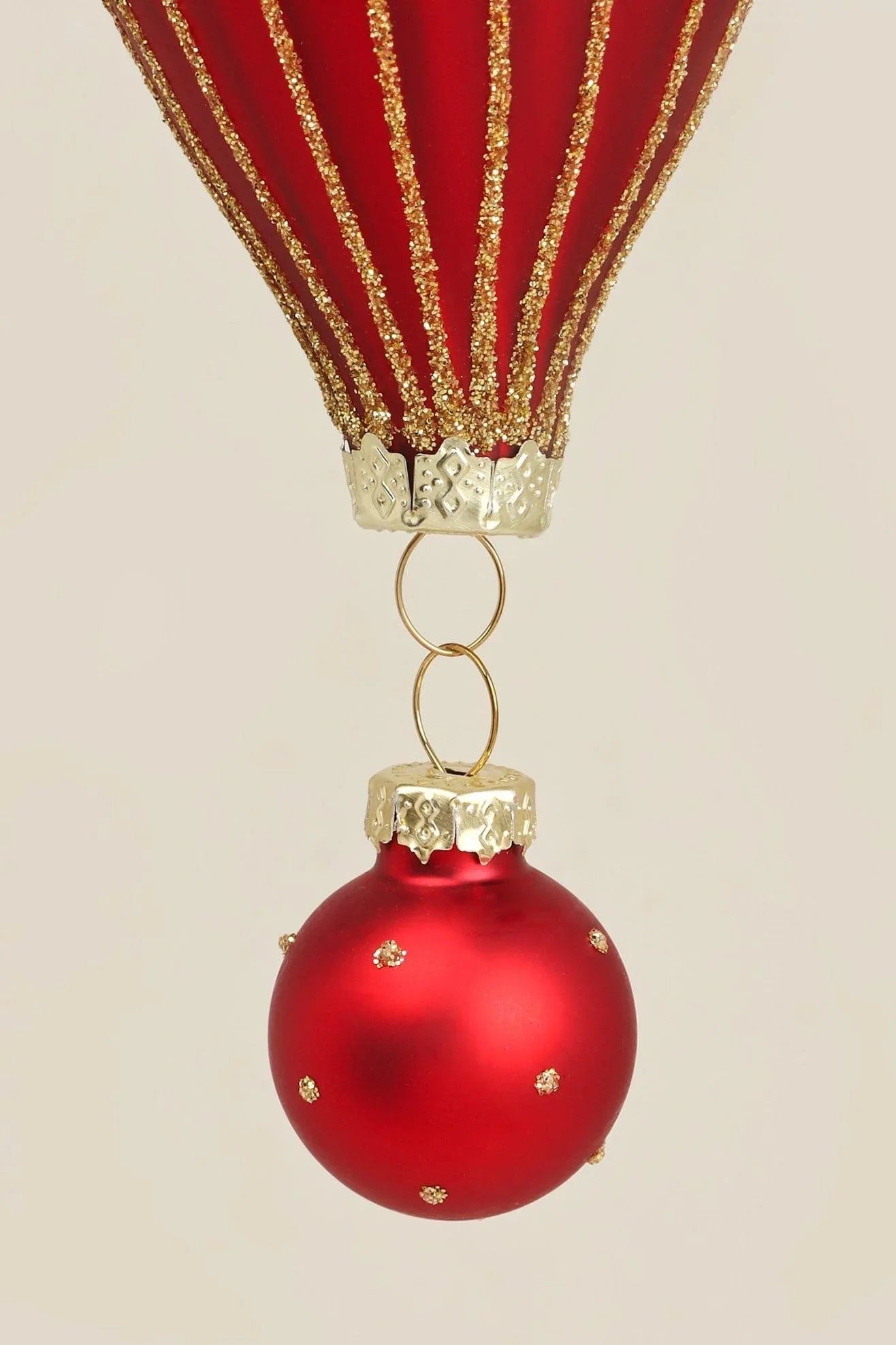Hand-Painted Glass Hot Air Balloon Christmas Bauble in Red and Gold — close-up view, G Decor
