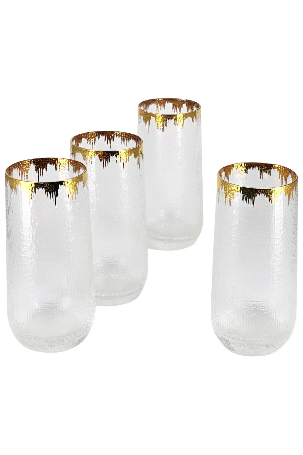 Four hammered glass tumblers with gold splash rims on a white background
