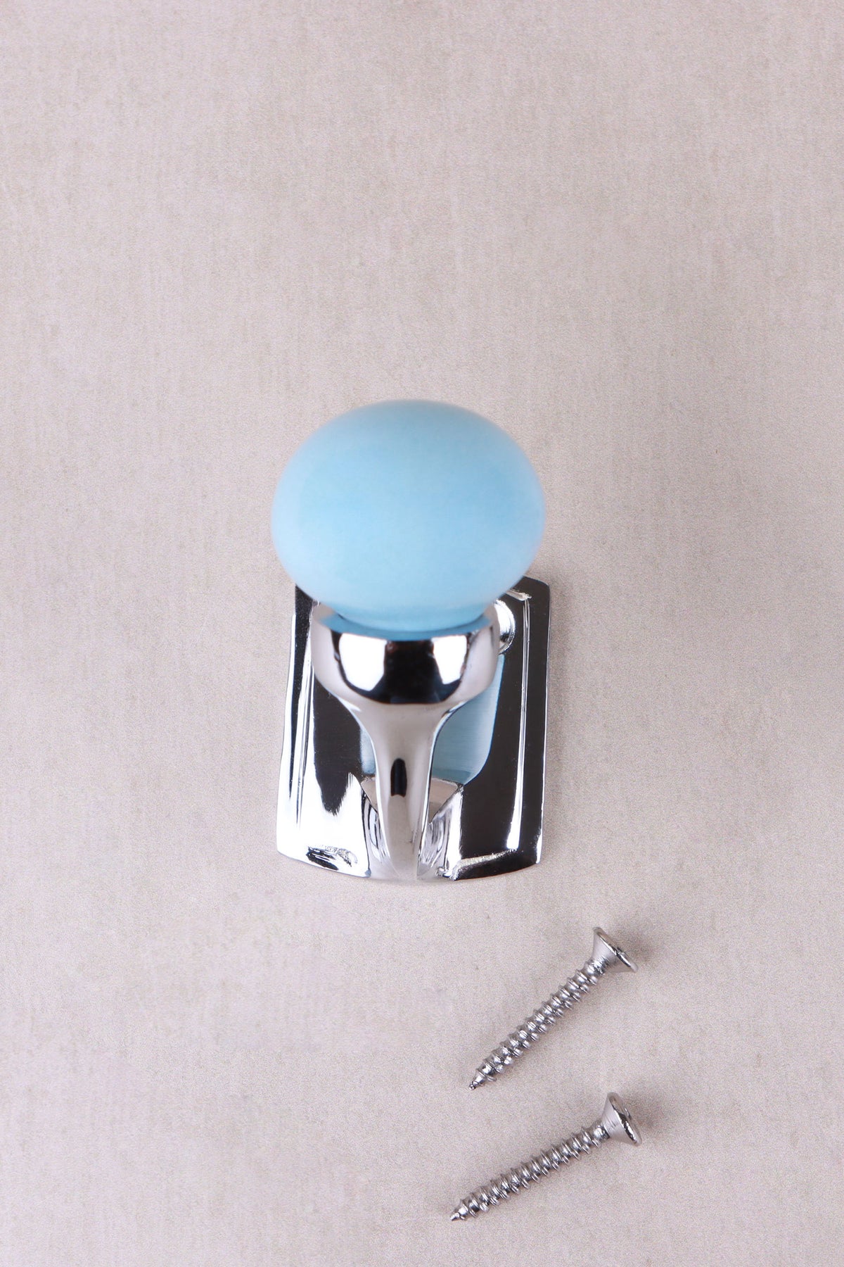 Light blue ceramic ball hook on a chrome finish hook and back plate, with its two chrome finish screws