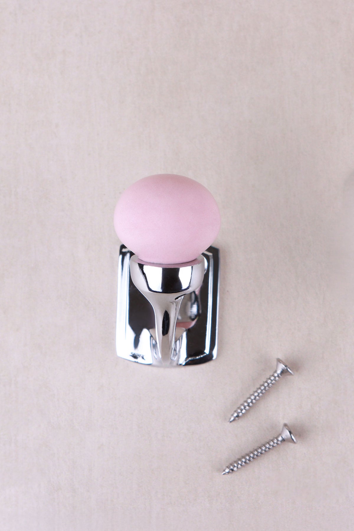 Light pink ceramic ball hook on a chrome finish hook and back plate, with its two chrome finish screws