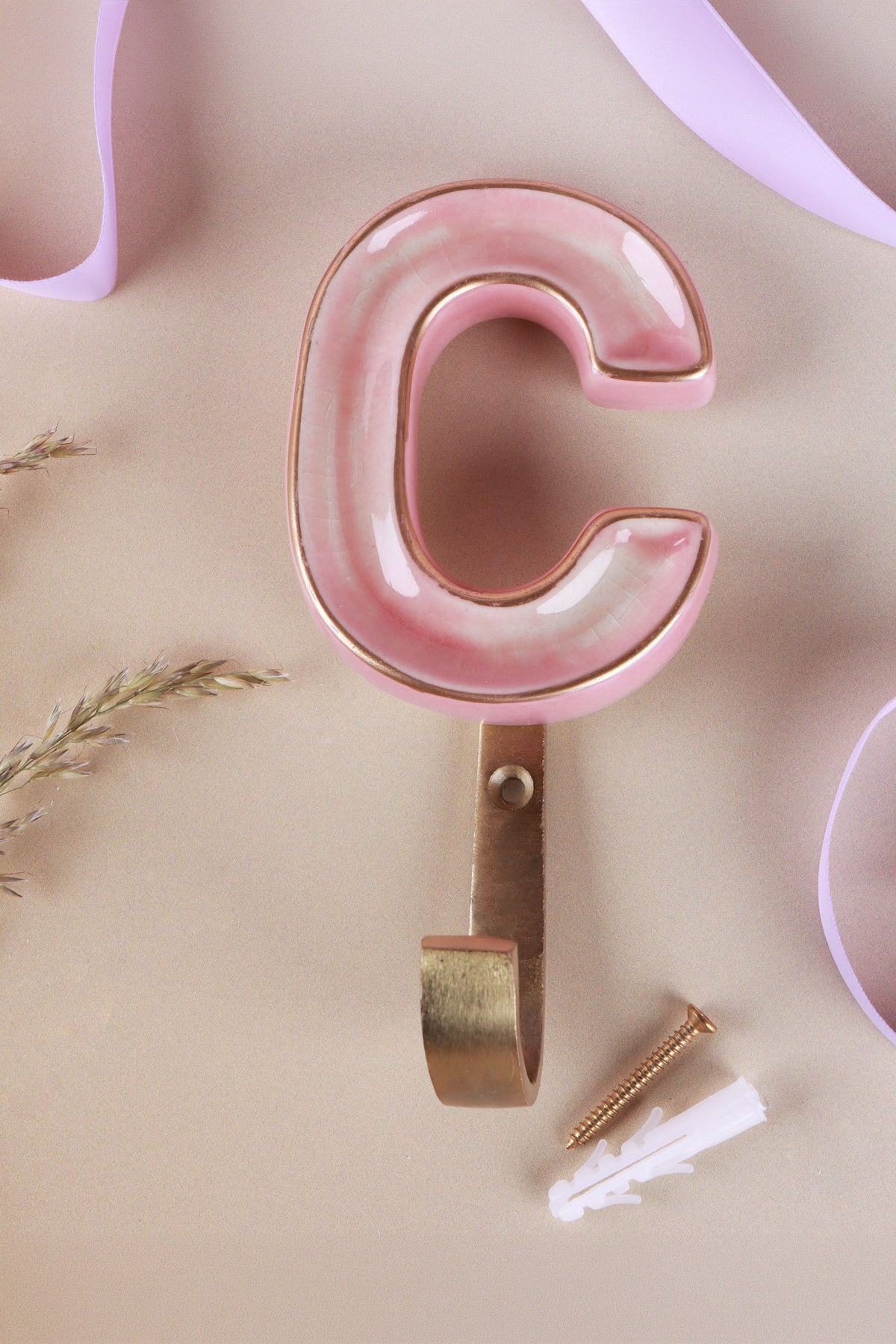 Pink ceramic letter hook C with a gold rim