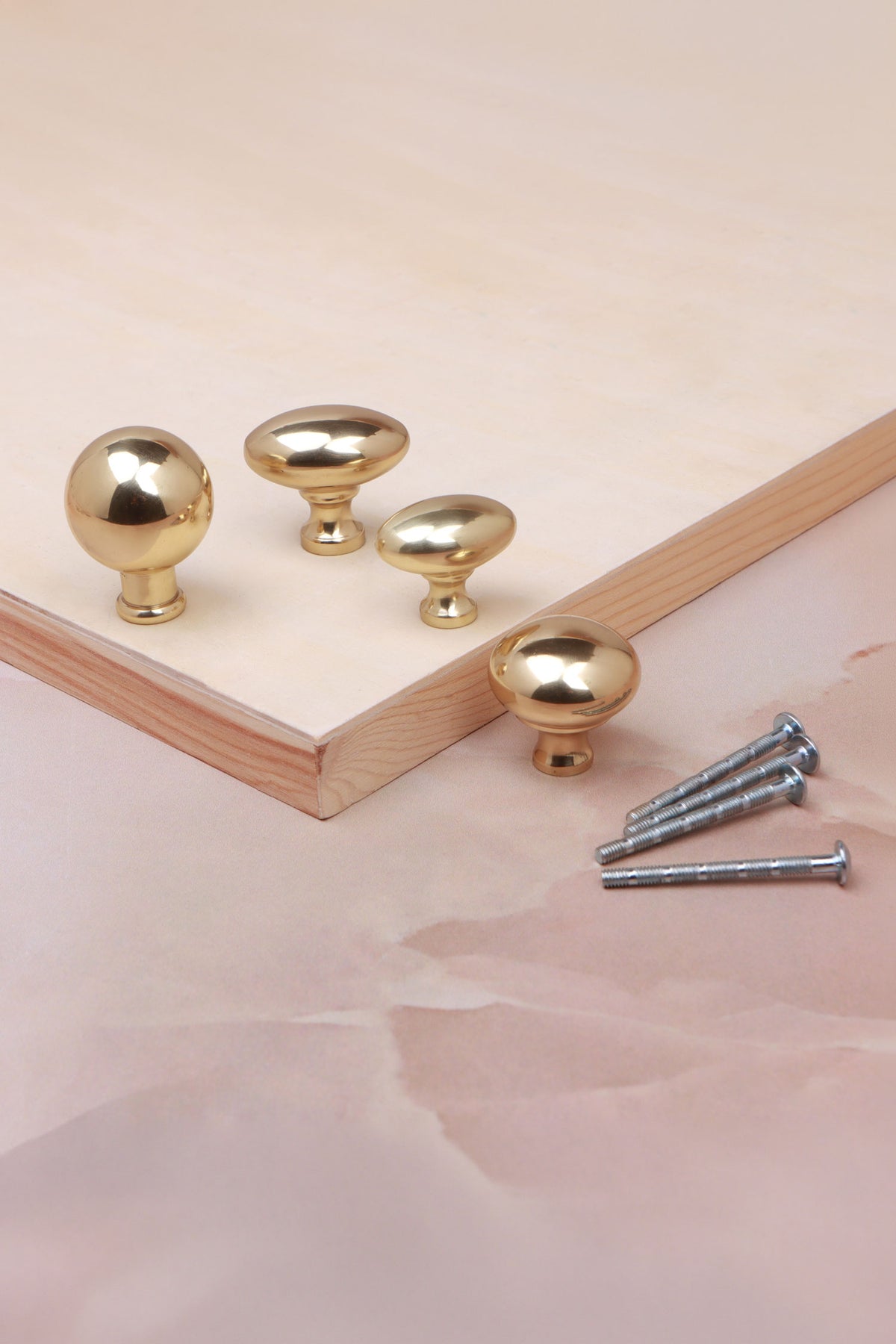 Cabinet knobs and backplates in polished brass, fifth view