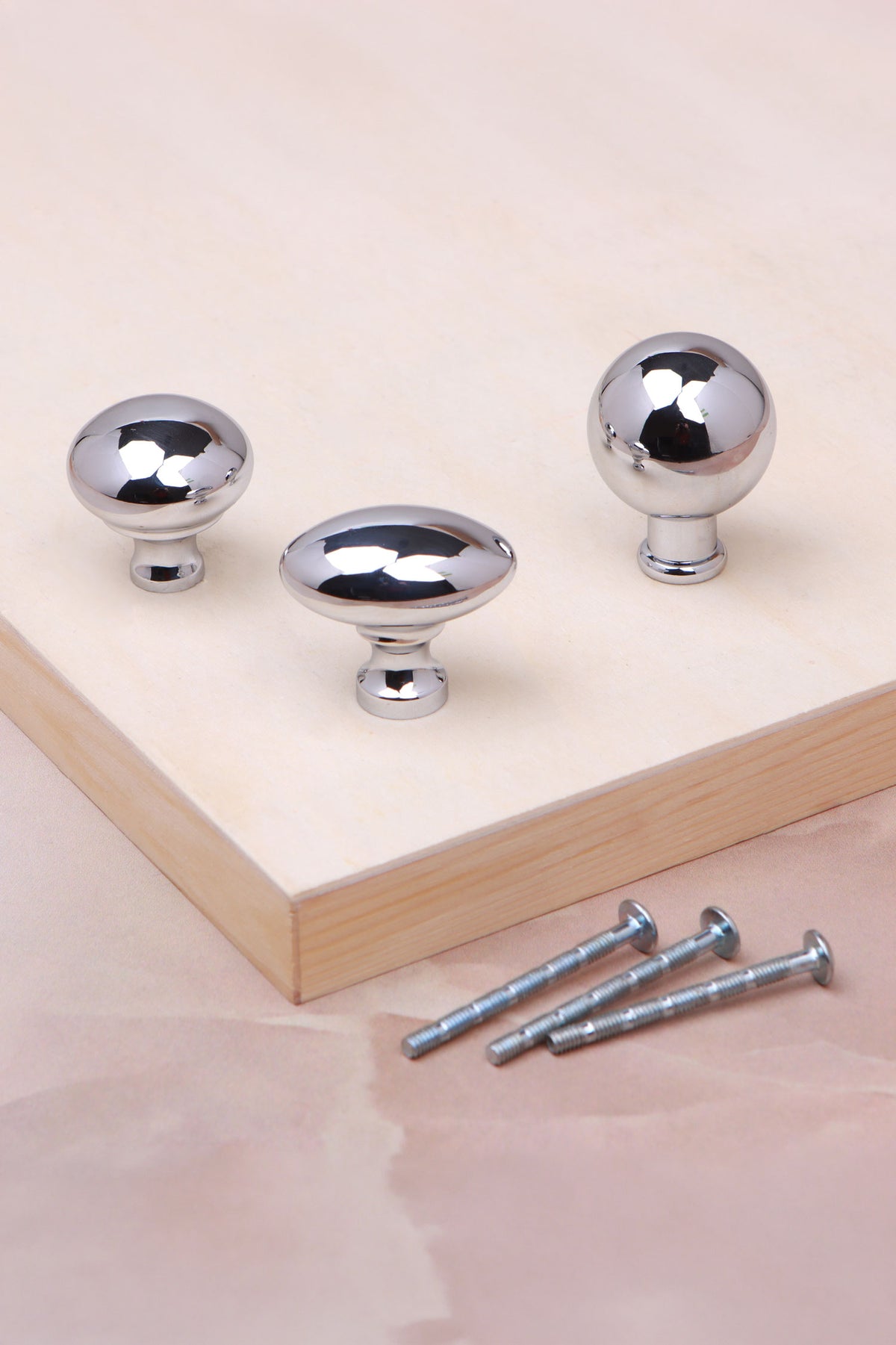 Cabinet knobs and backplates in polished chrome, fifth view