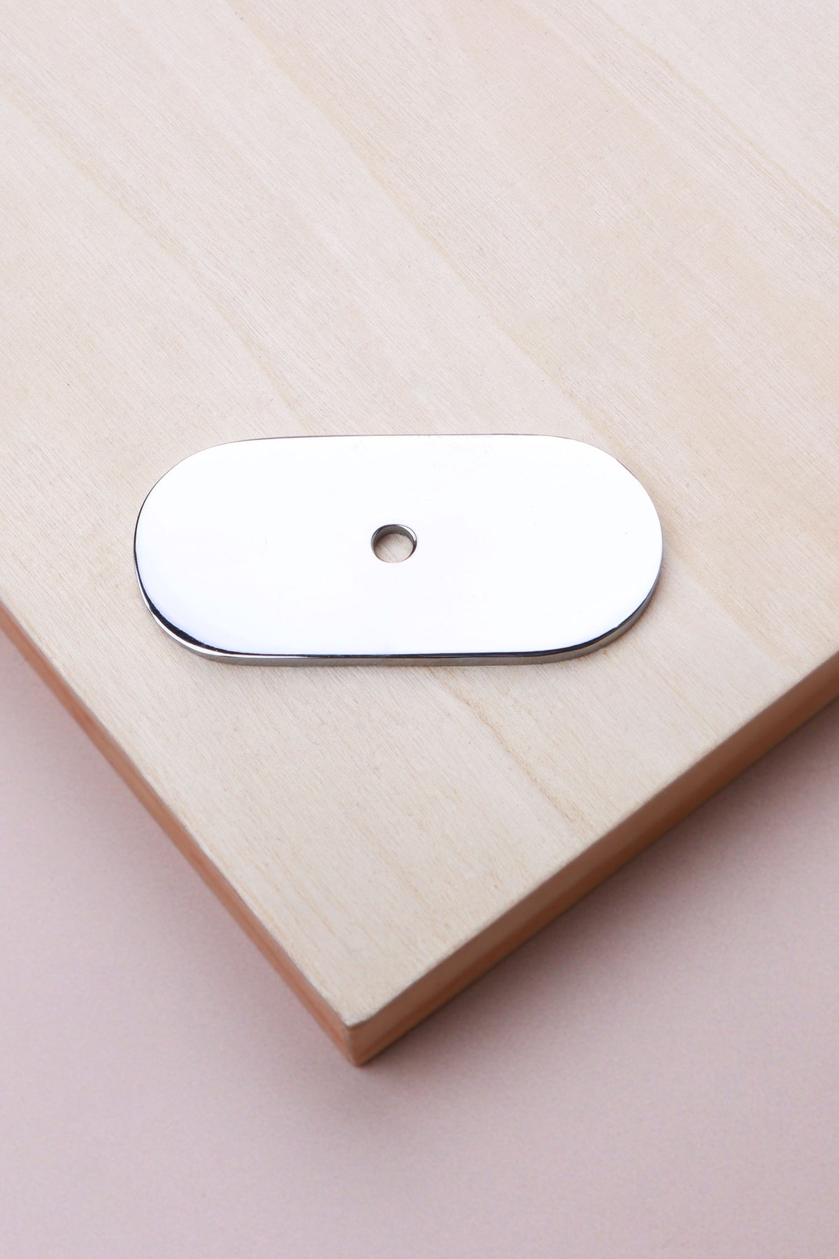 Polished chrome oblong backplate, 54 x 25mm with rounded ends: chrome-plated solid brass with a 4mm centre hole for the knob bolt