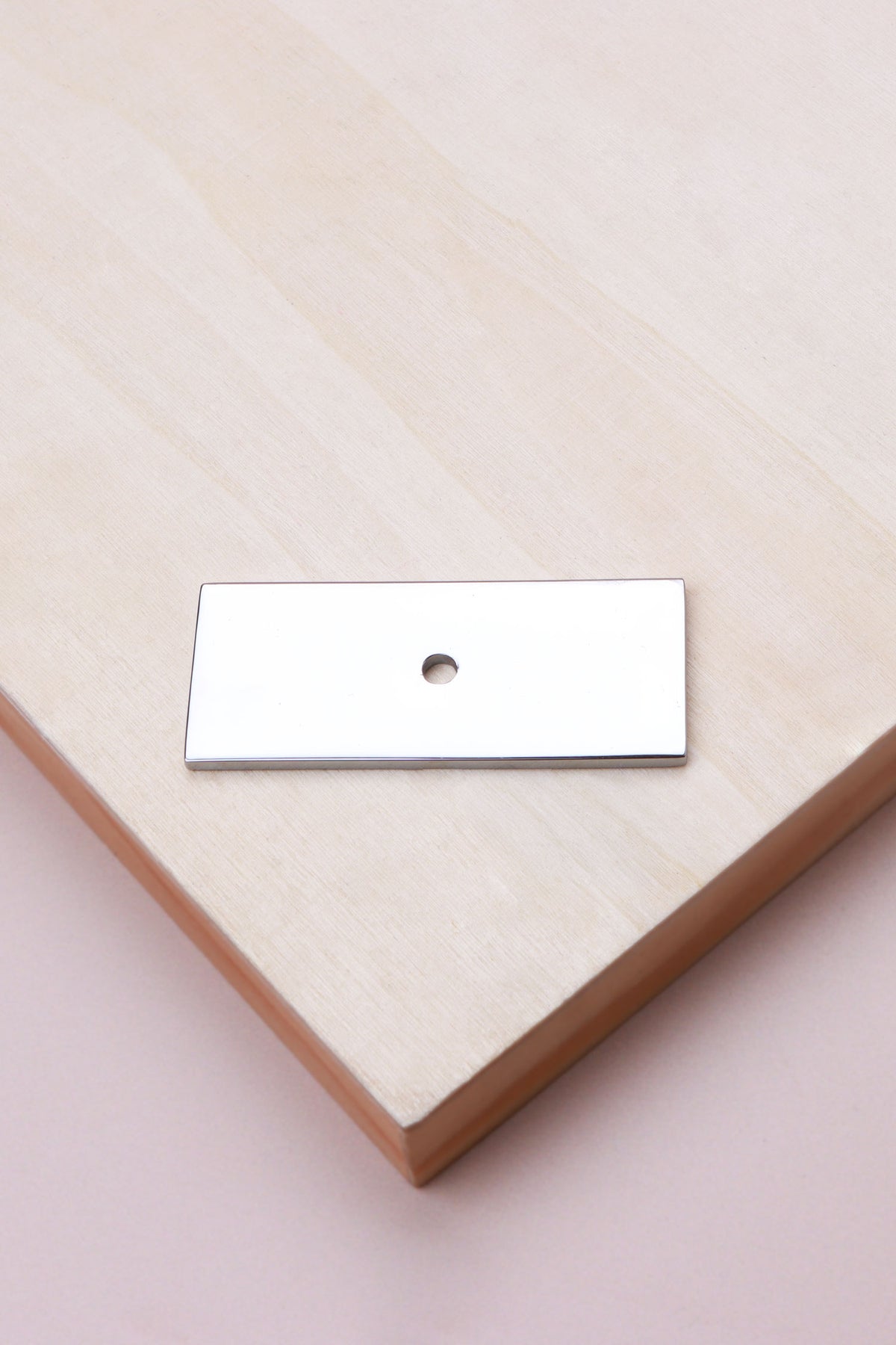 Polished chrome rectangle backplate, 60 x 25mm: chrome-plated solid brass with a 4mm centre hole for the knob bolt