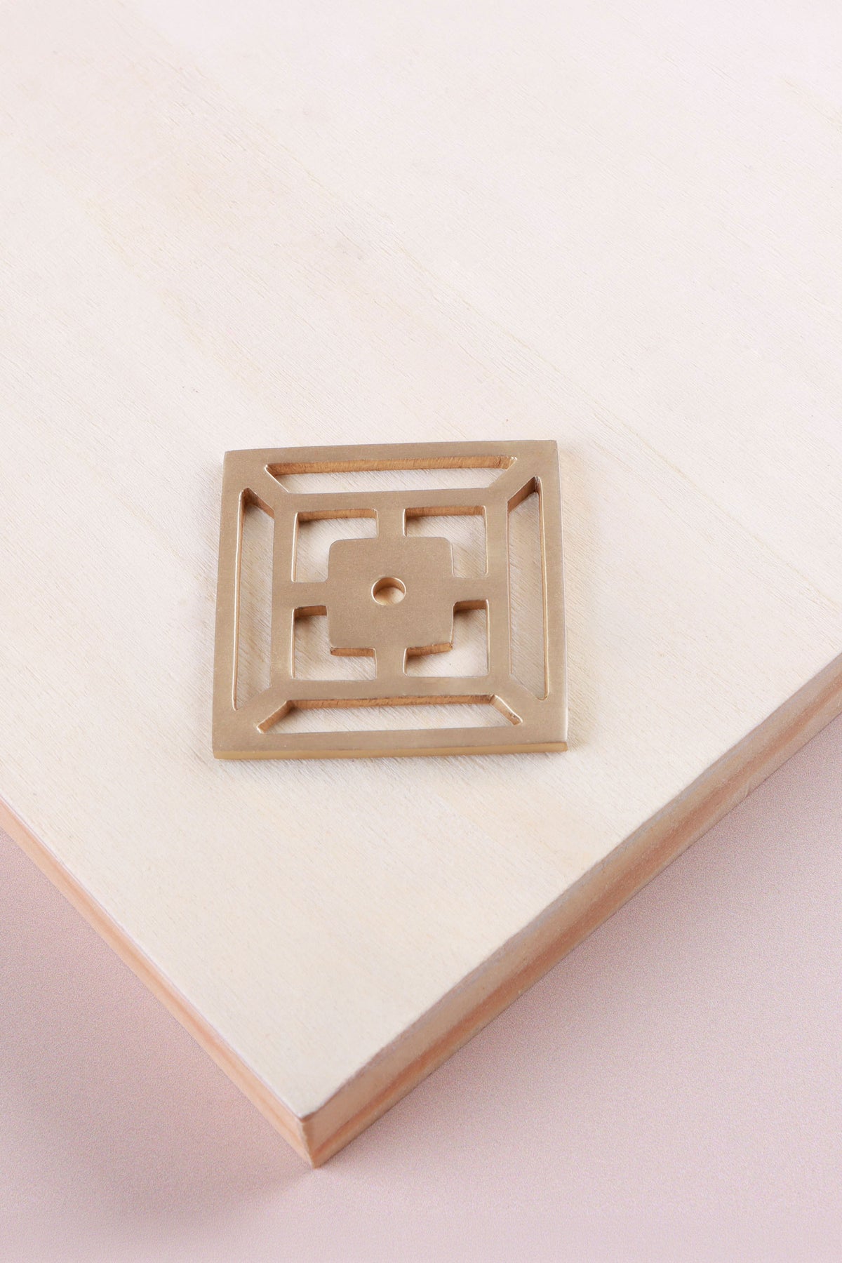 Satin brass fretwork backplate, 45 x 45mm, an open square fret: solid brass with a 4mm centre hole for the knob bolt
