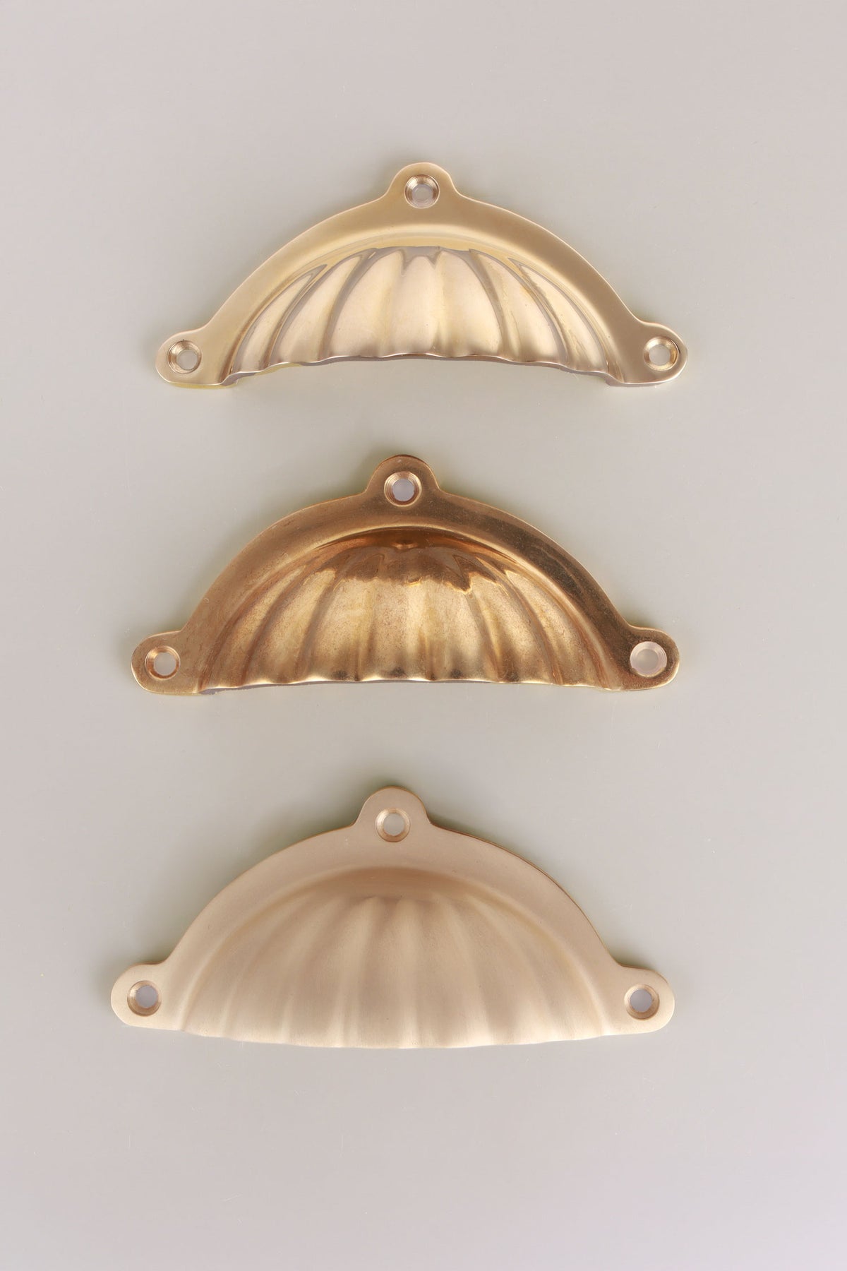 Scalloped cup pull in polished, aged and satin brass, third view