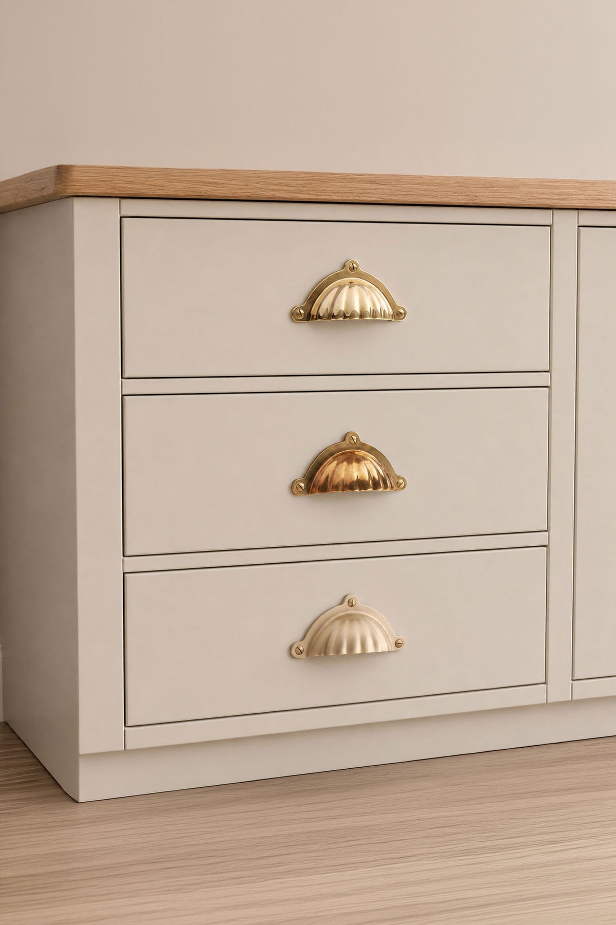 Scalloped cup pull in polished, aged and satin brass