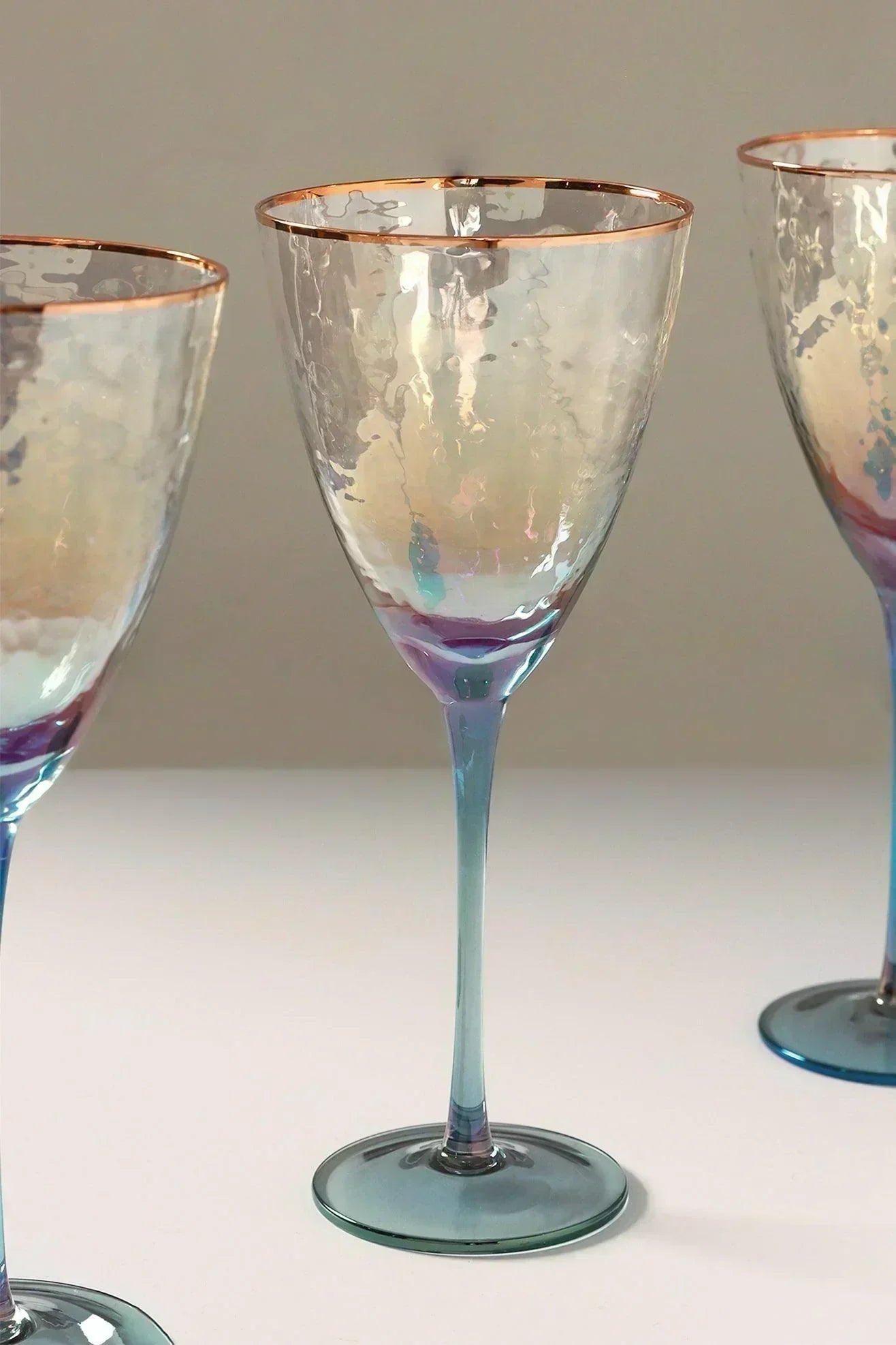 Set of four iridescent grey hammered wine glasses styled together — G Decor